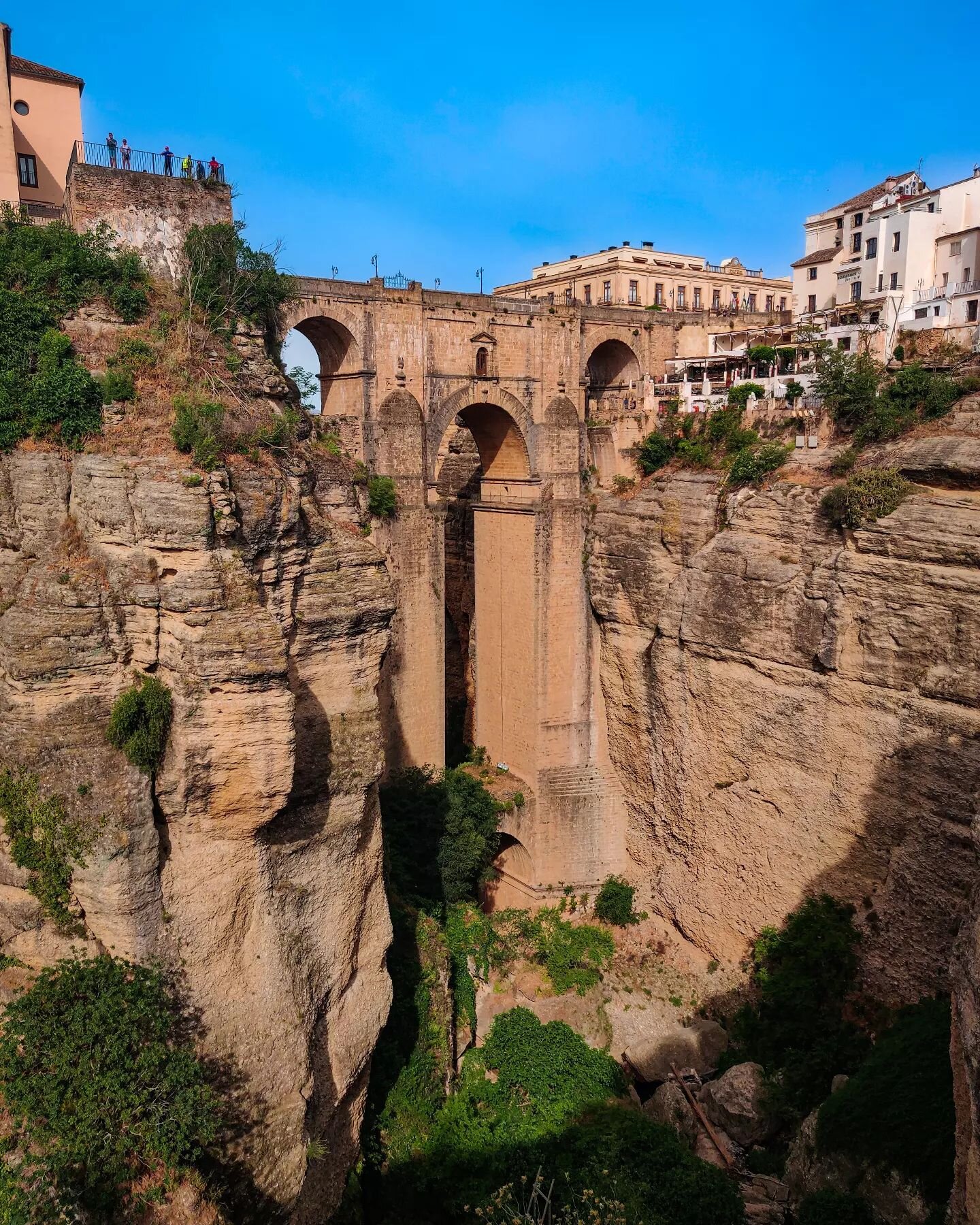 In Ronda, you'll find one of the most impressive gorges on the face of the earth. The closest thing to Middle Earth's Rivendell that I have ever seen. It's enchanting. It's breathtaking. It's magical. 

The gorge and iconic bridge has no obligations 