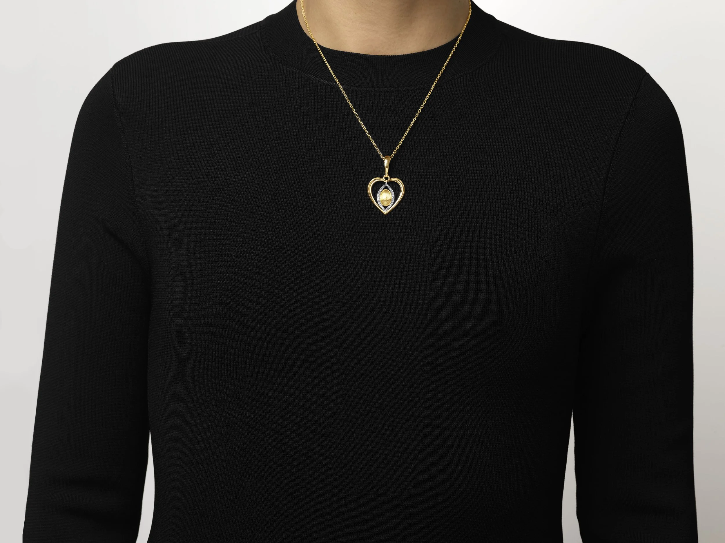 18K yellow gold Prosperity Heart Pendant by NAONES featuring a platinum vesica piscis set with VS1 pave´diamonds and rigato-engraved gold egg at the center, suspended on an adjustable gold chain.