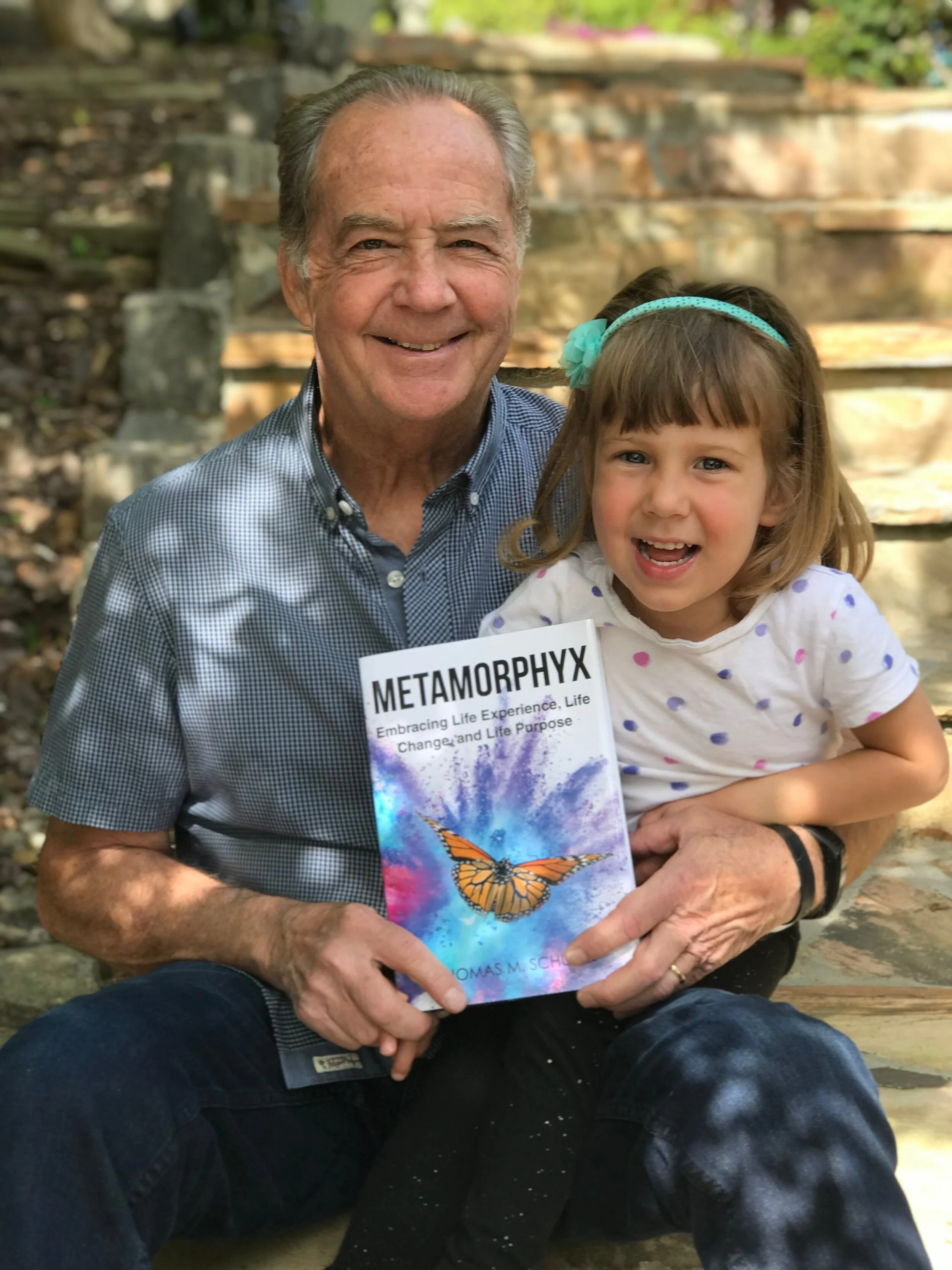 Tom with his three year-old granddaughter, Cara. Sheer joy!!
