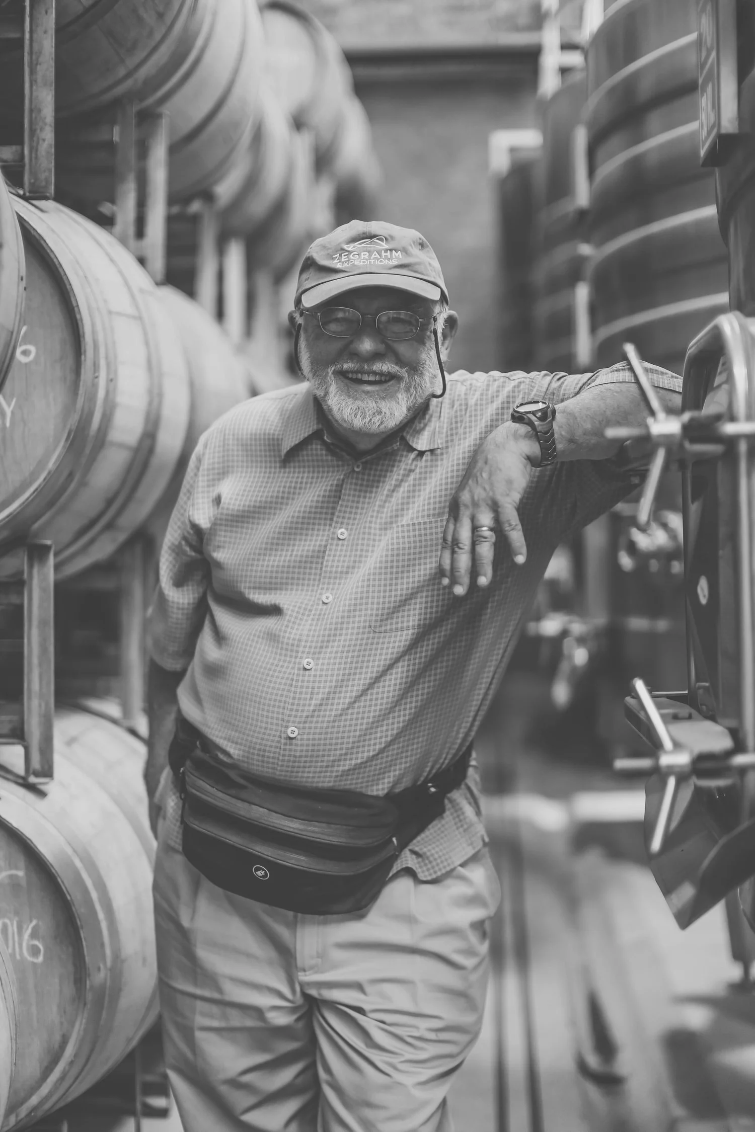 Owner, Wayne Tamarelli, infront of our once-used French-oak barrels.