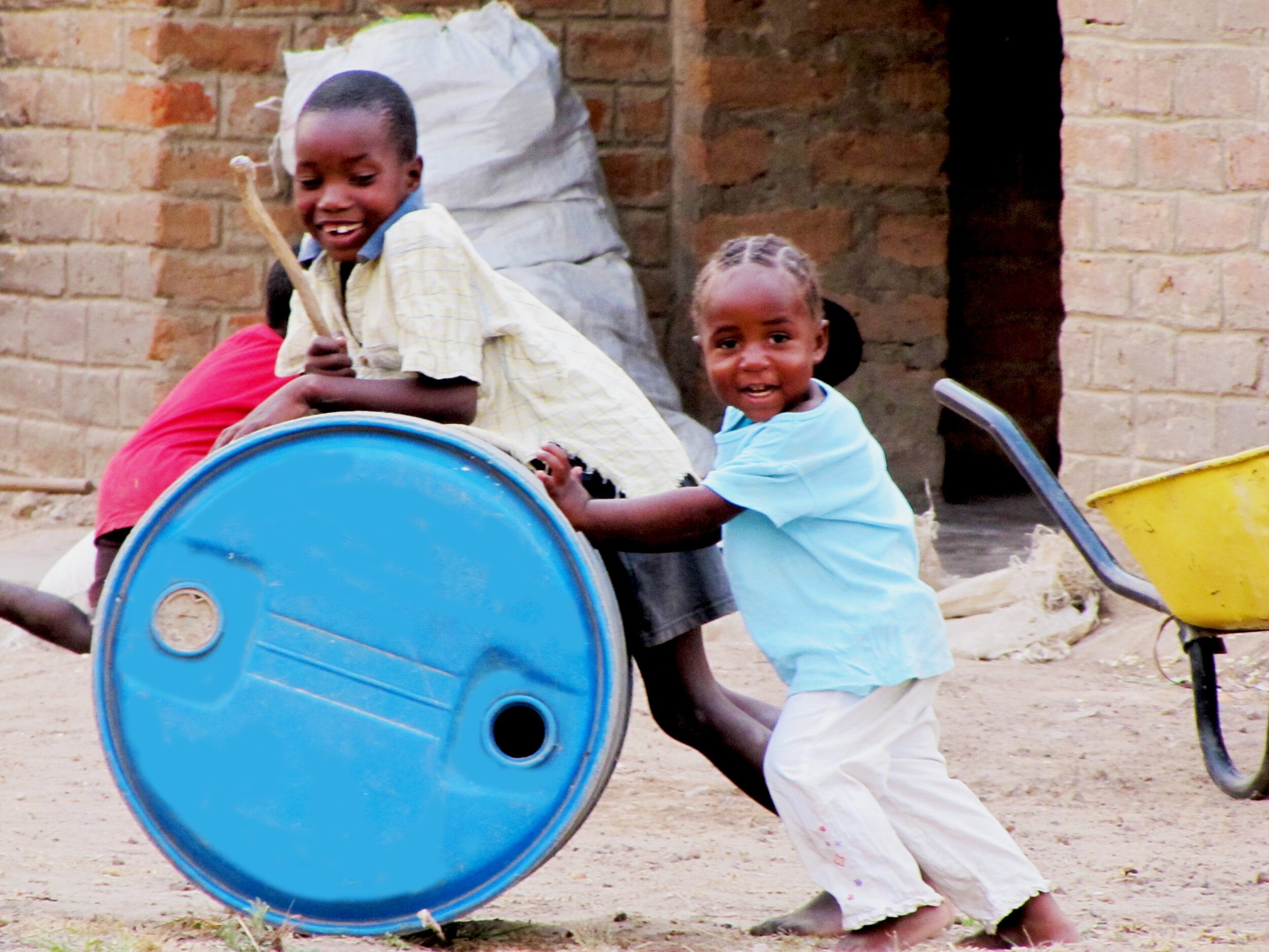 Castro &amp; Evelyn at play at House of Faith Orphanage, in Silembe, Zambia. 