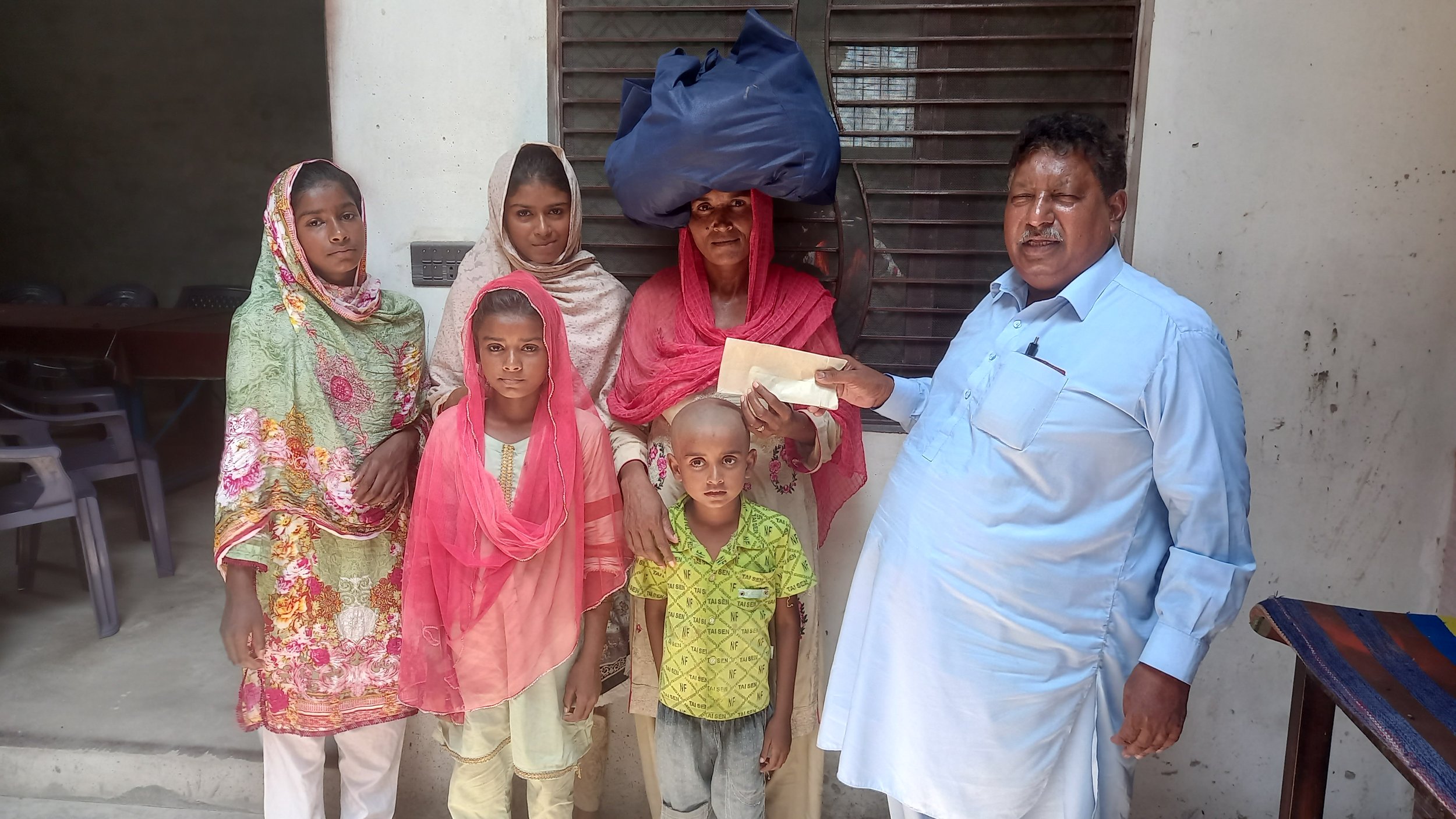  Widow Kausar Bano is receiving Food bag &amp; other support. 