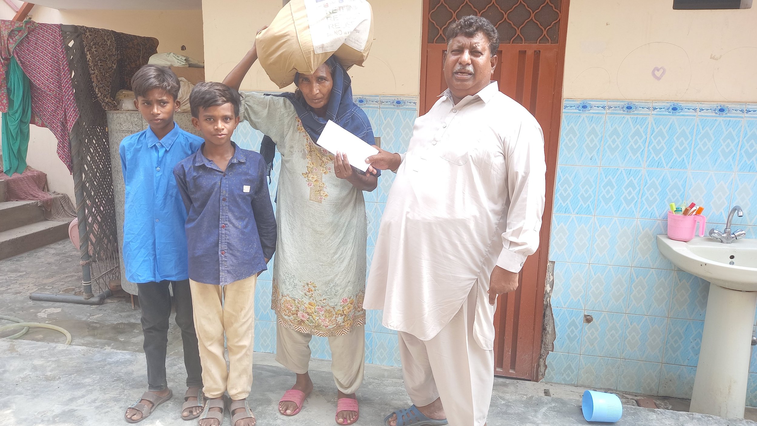  Widow Nusrat is receiving Food Bag &amp; Support from Pastor Saleem Raza 