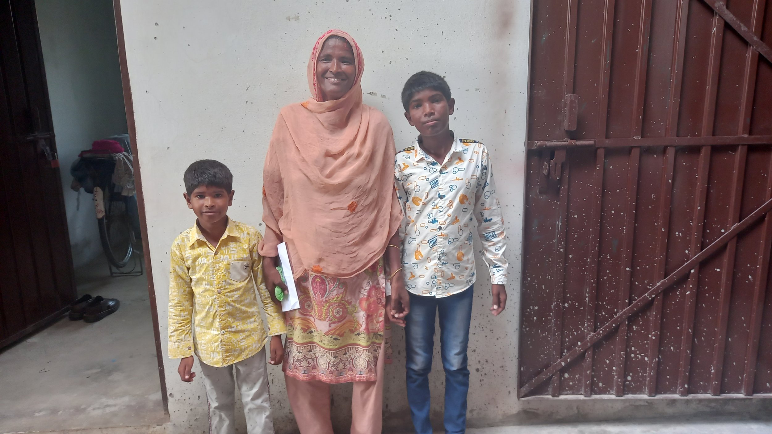 Widow Nasreen and her sons.jpg