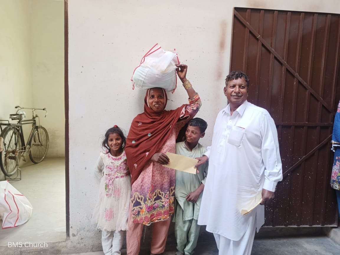  Widow Irshad and her children receive food bag &amp; support. 