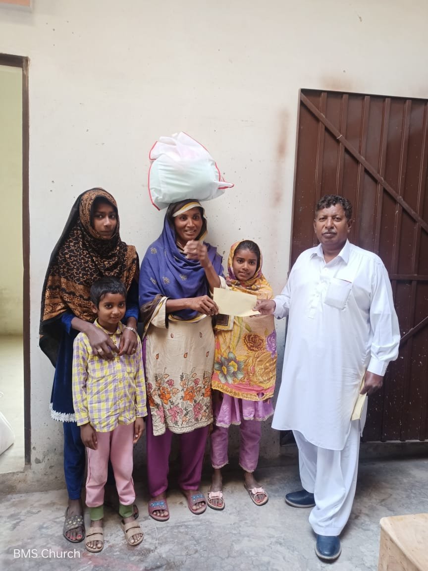  Widow Kausar Bano is happy to receive aid. 