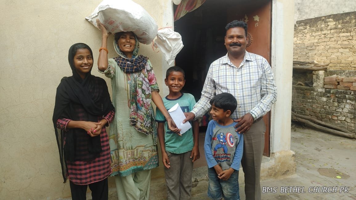 Pastor Rafique distributes food bag and support to Widow Sobia