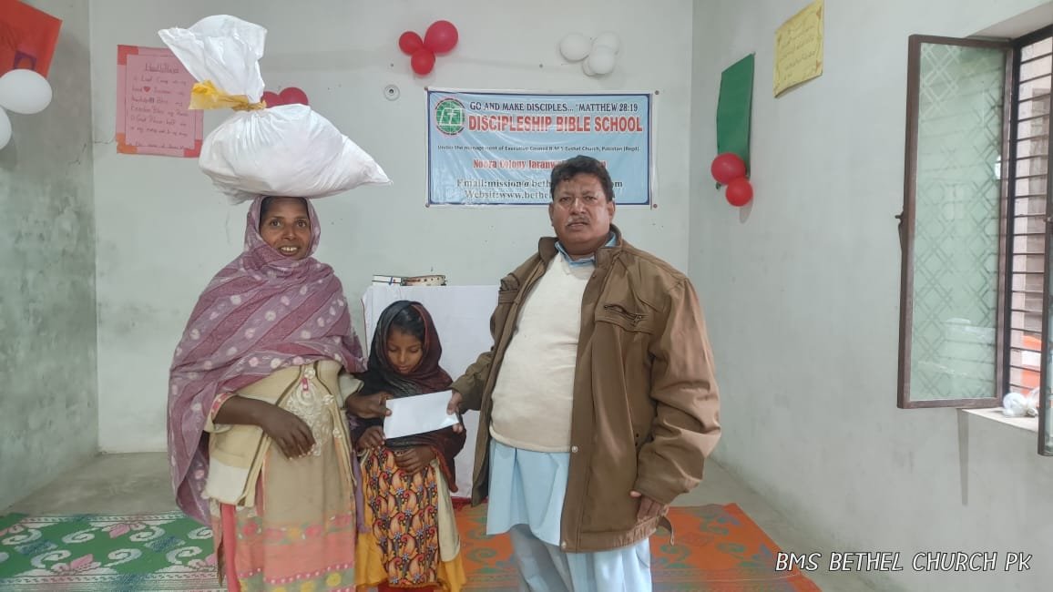 Pastor Saleem Raza distributes Support &amp; Food Bag to widow Irshad.