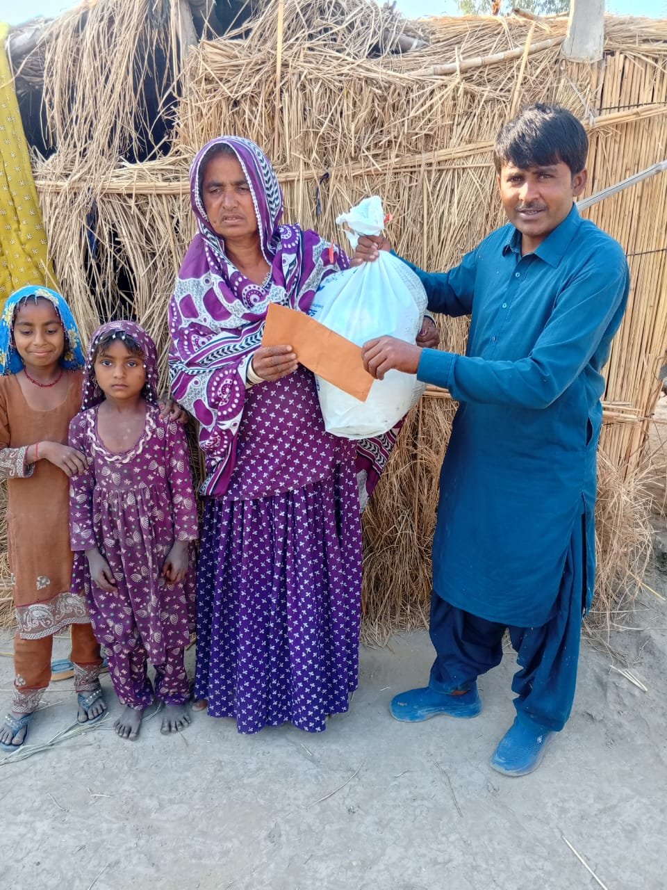 Widow Jamiat received food bag and support happily
