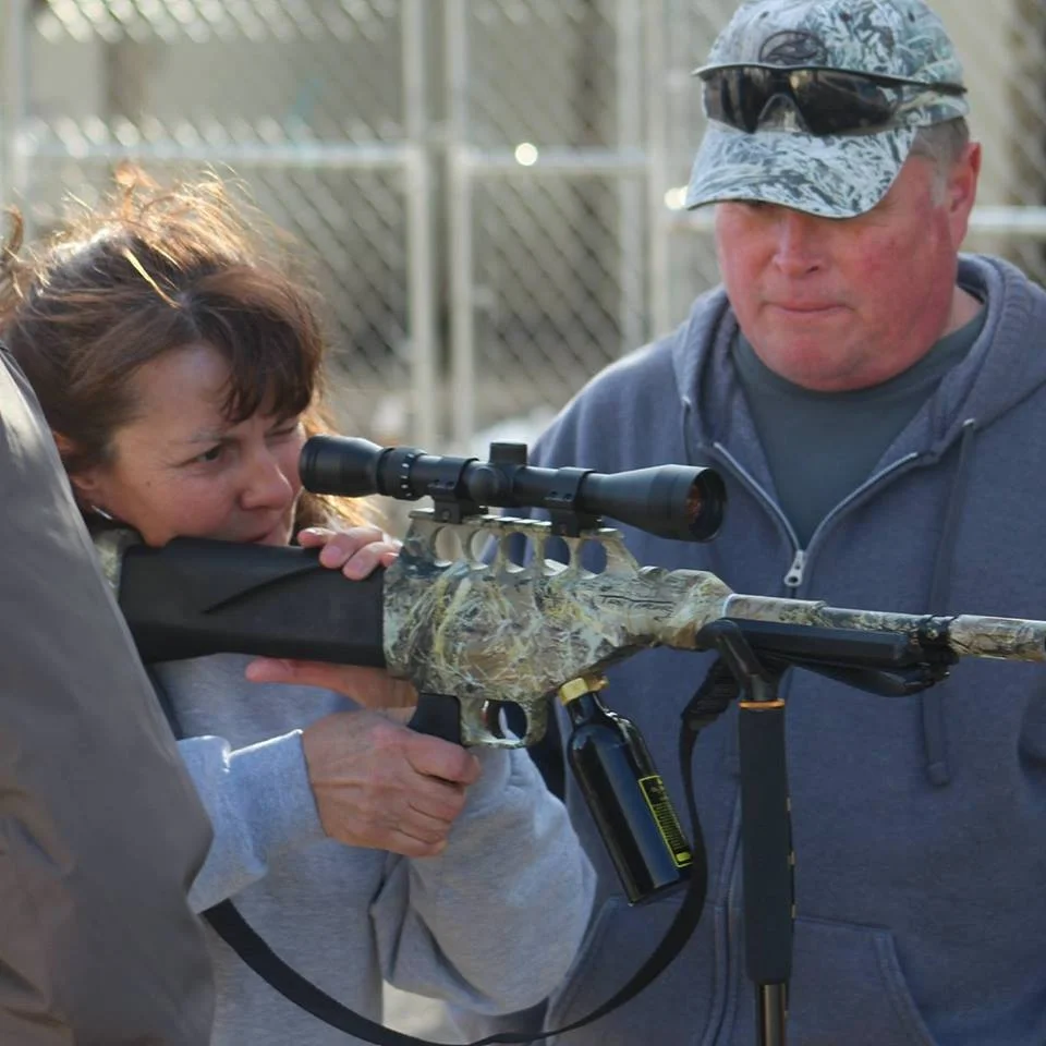 A Fish Springs Wild Horse Alliance volunteer learning to dart wild horses