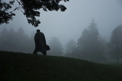 man holding bag in trees-min-min.jpg