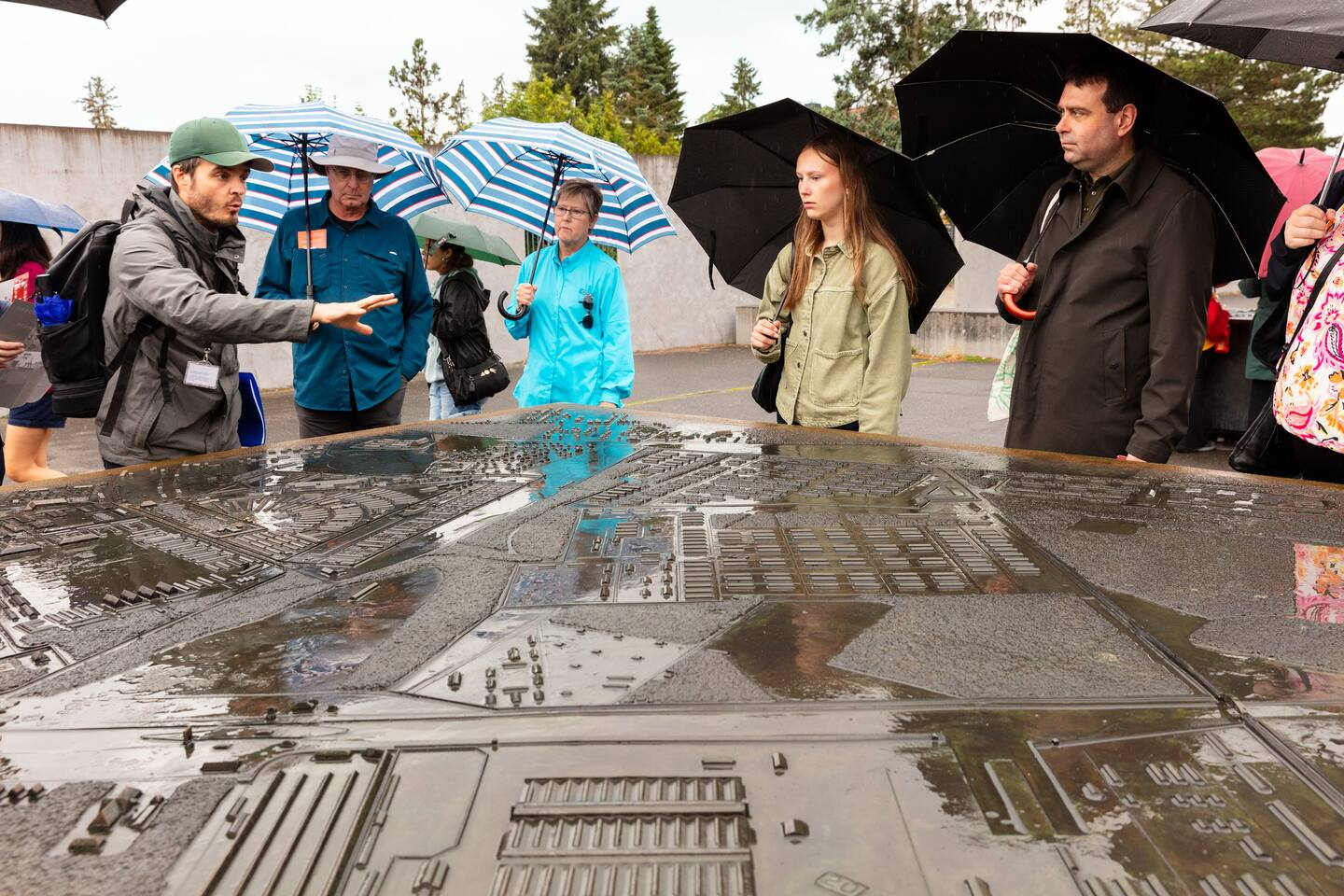 WWII historian explaining the camp layout model during a small group Sachsenhausen tour from Berlin