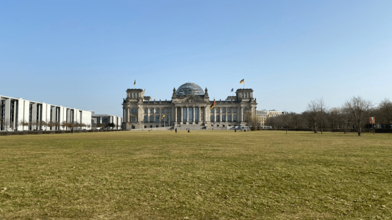 The Reichstag across Platz der Republik — the ground of the final Soviet assault, walked on this tour