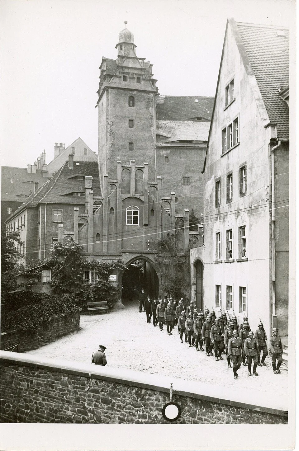 Allied prisoners from Oflag IV-C being escorted under guard at Colditz