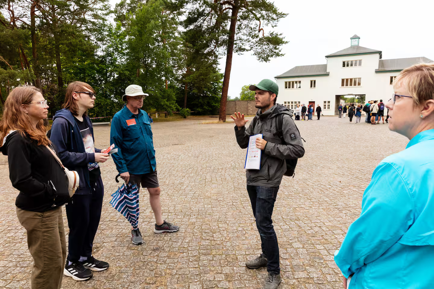 WWII historian introducing visitors to Sachsenhausen Concentration Camp during a small group tour from Berlin
