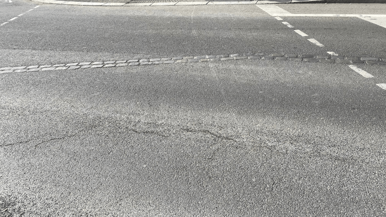 The double cobblestone line set into the street marking where the Berlin Wall once ran, in Berlin.