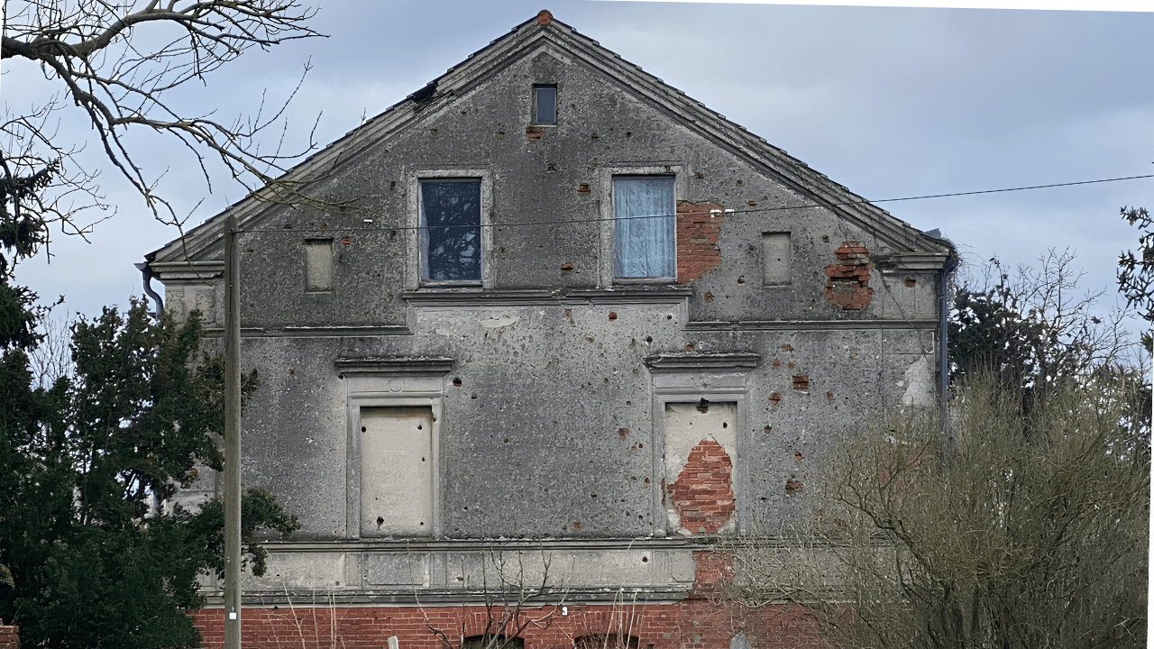Brick building on the Seelow Heights still showing shell and small-arms damage from the 1945 battle