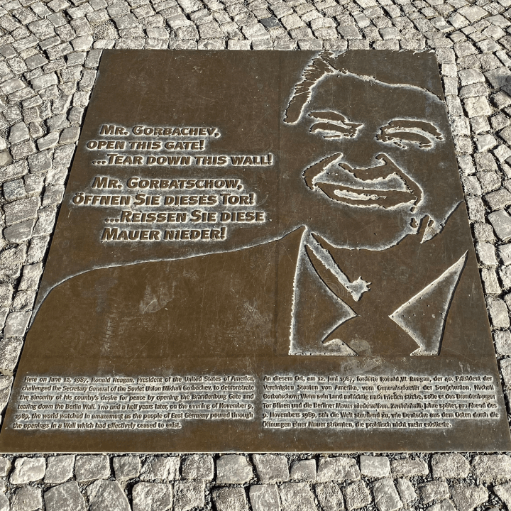 The bronze pavement plaque marking where Ronald Reagan gave his "tear down this wall" speech near the Brandenburg Gate, Berlin.