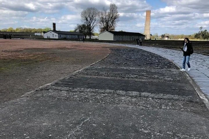 View across the former prisoner grounds at Sachsenhausen with the central memorial in the background