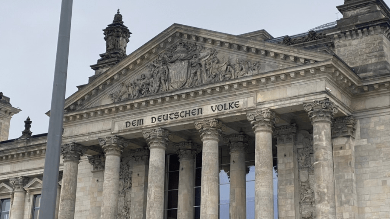 The Reichstag's classical facade and inscription in Berlin, a stop on the private WWII and Cold War walking tour.