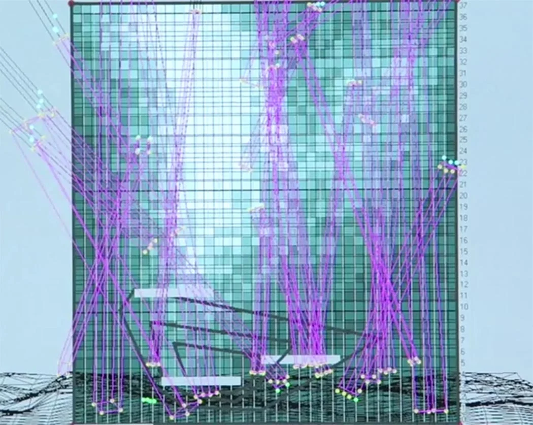 Timber wire-frame structure with background lighting.