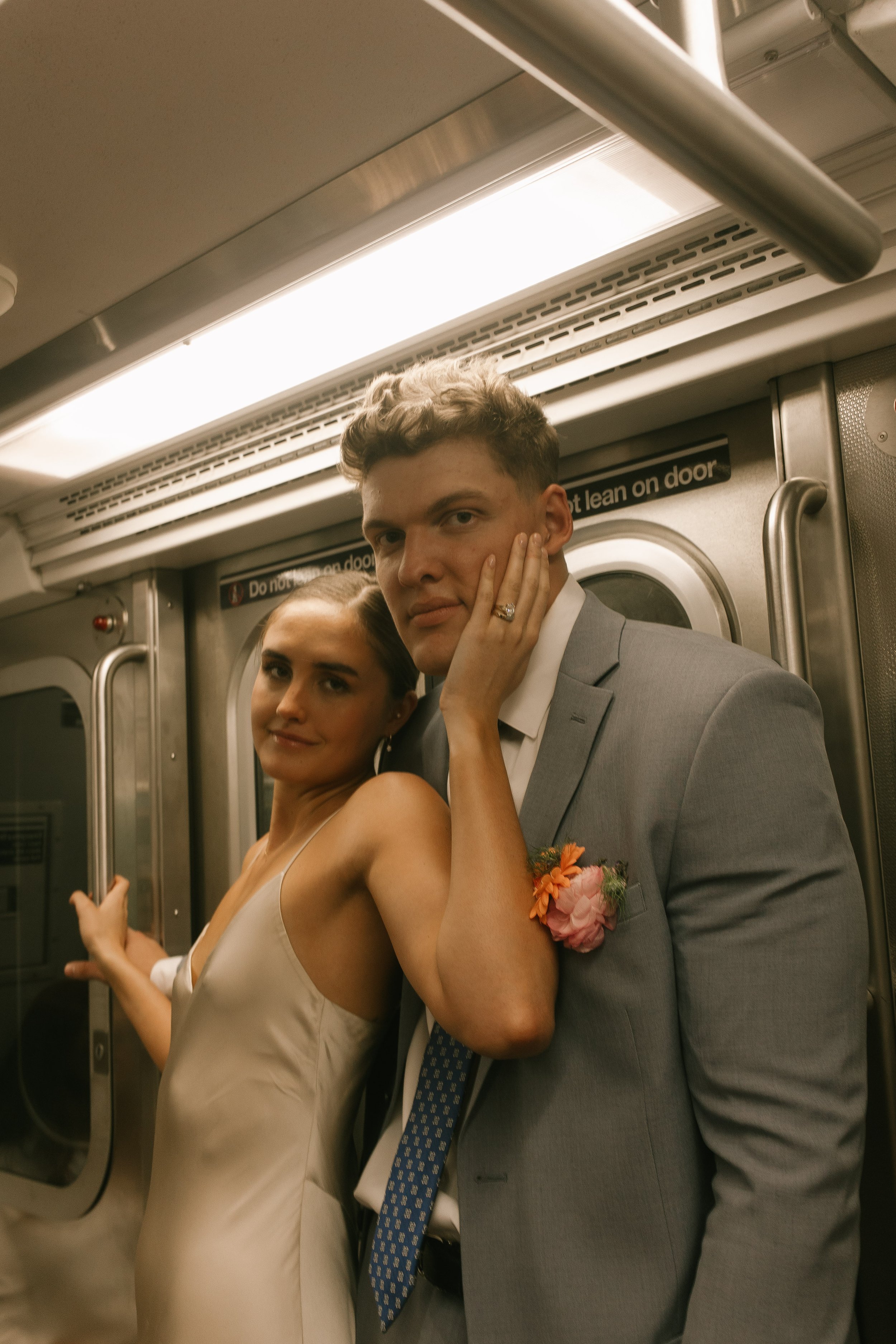 ust married and riding the subway—this New York City elopement couple brings classic city grit and glam to the train car.