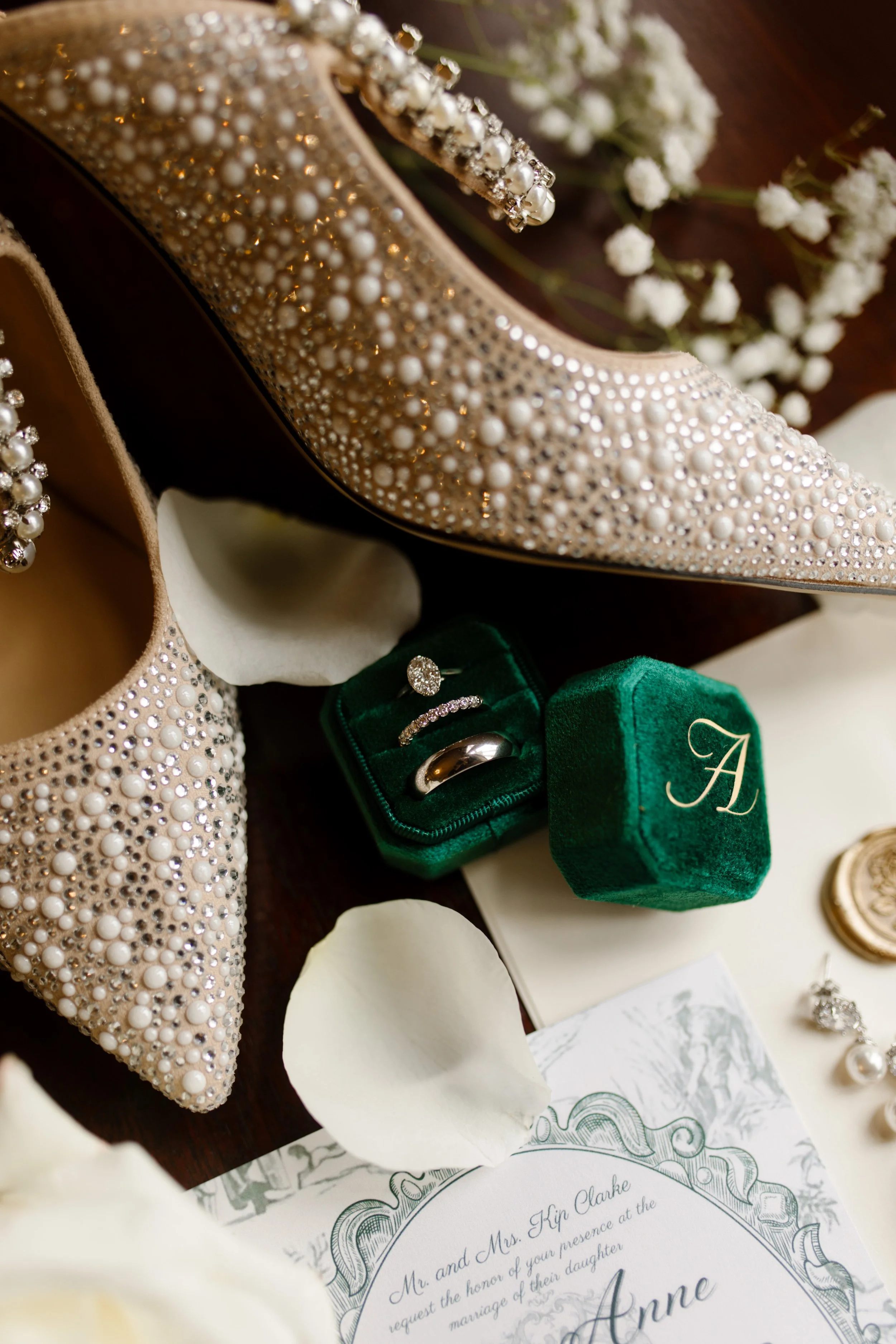 Pearl-studded heels, a green velvet ring box, and a vintage-style invitation suite styled perfectly for this romantic Arkansas wedding day.