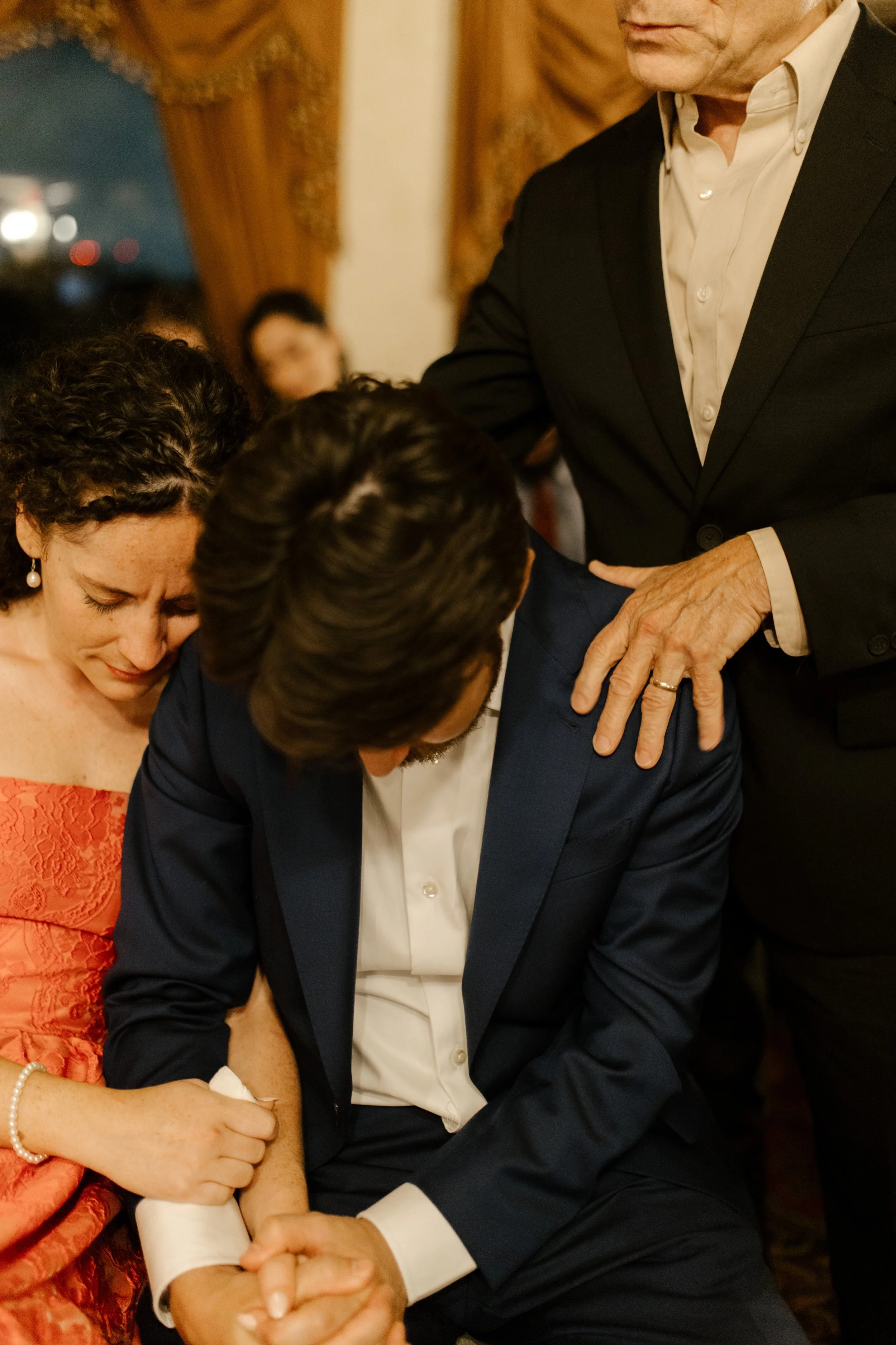 The couple bowed together in an emotional moment of prayer and support during their New Orleans wedding welcome dinner.
