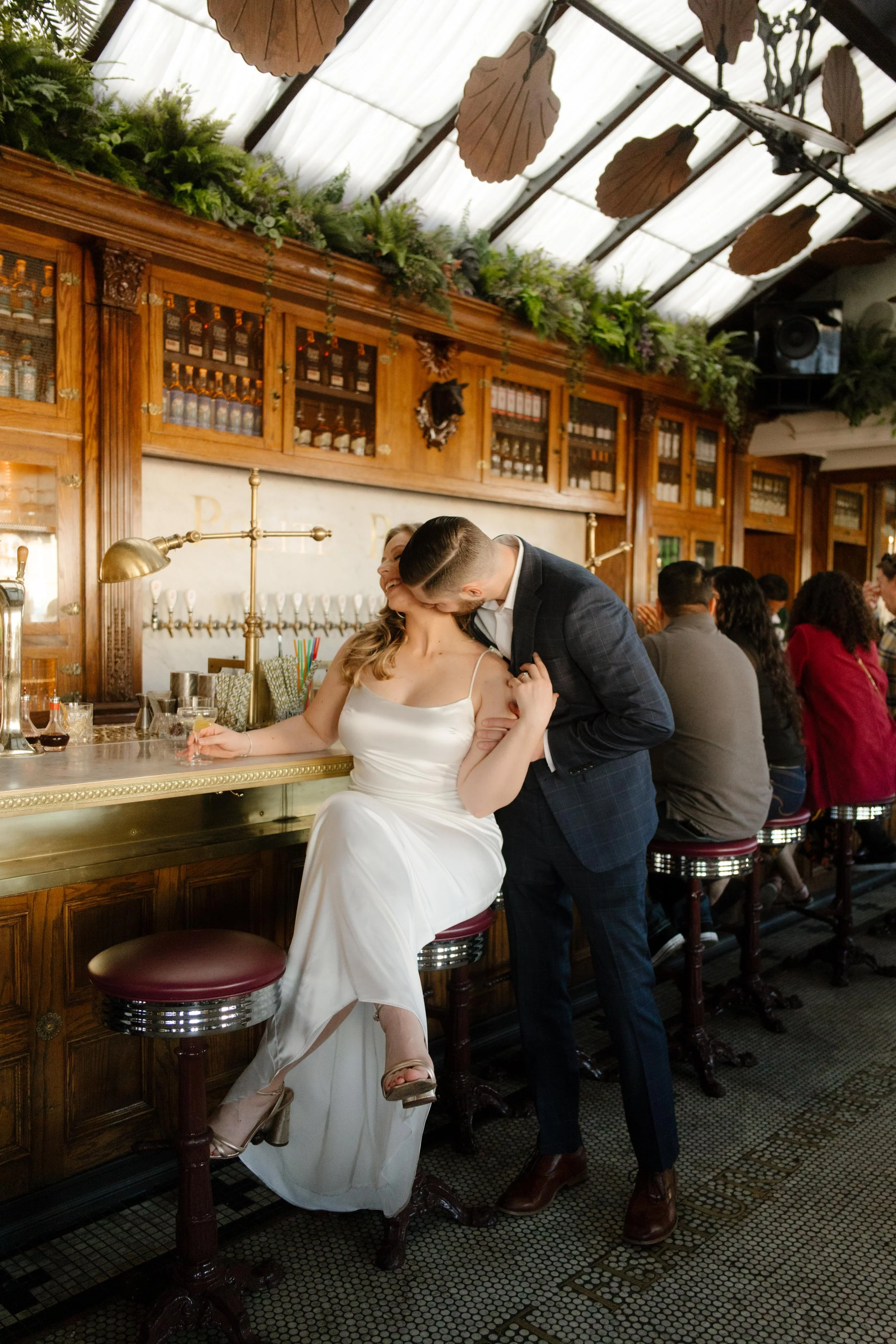 With vintage tiles underfoot and golden light all around, this bar moment brought elegance to their San Diego engagement photos.