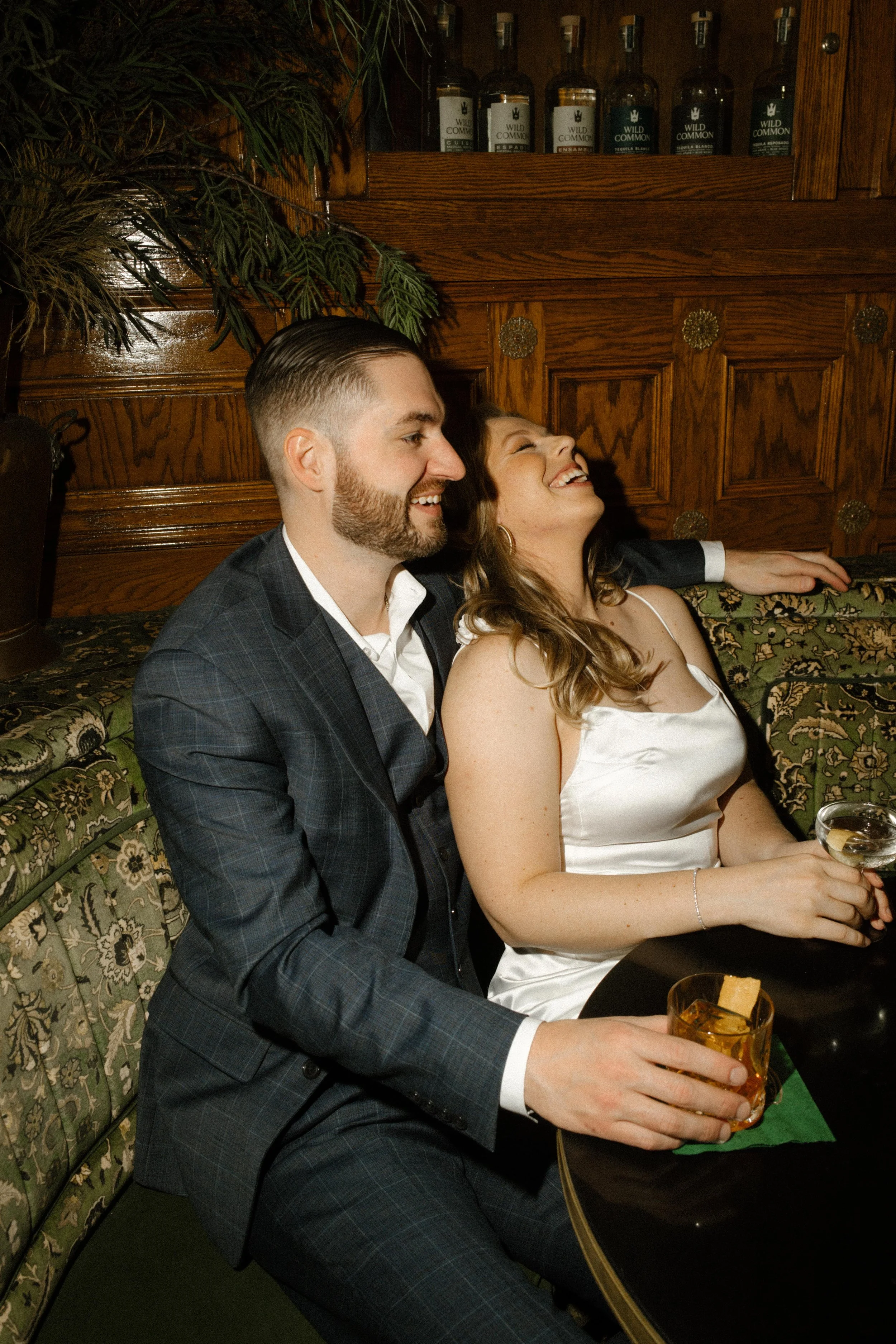A joyful moment caught mid-laugh, surrounded by vintage charm and golden light.