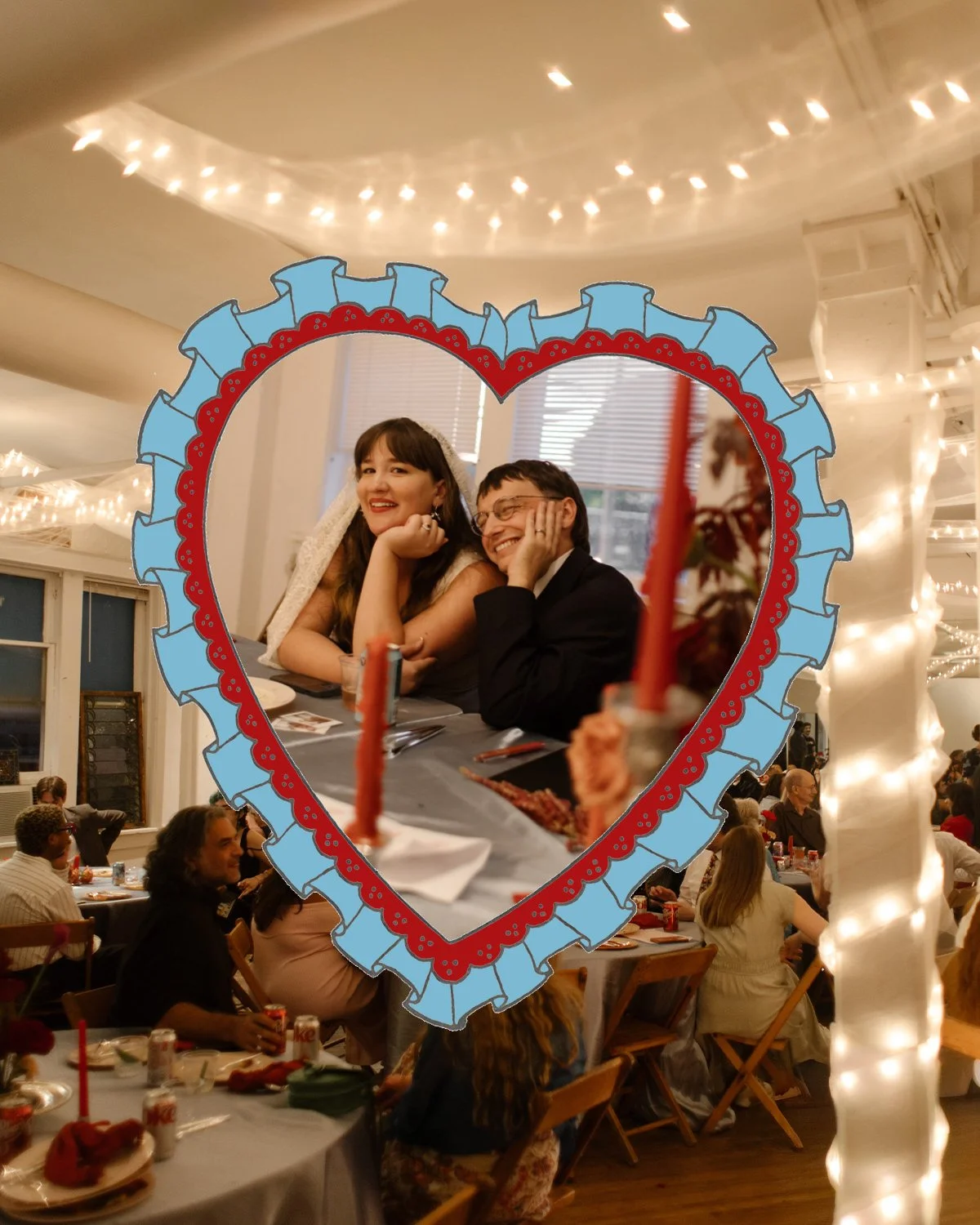 Playful heart-framed photo of the couple at their sweetheart table during their Tennessee wedding