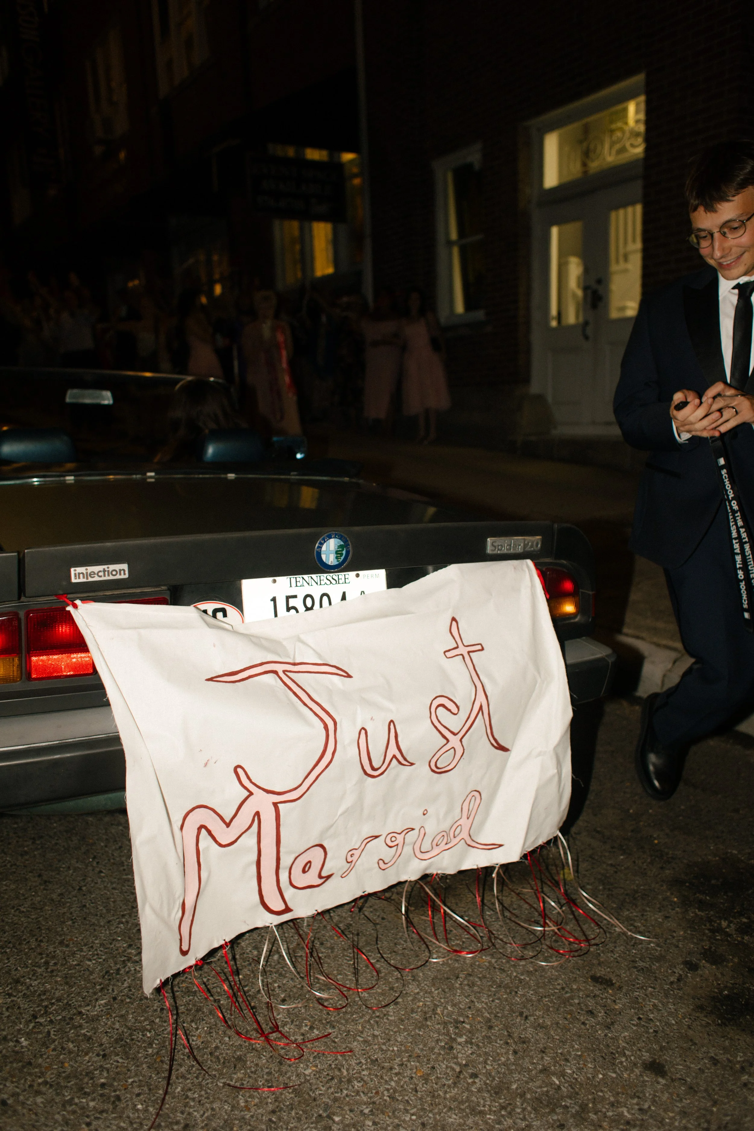Just married getaway moment with a vintage car and handmade sign at this Tennessee wedding