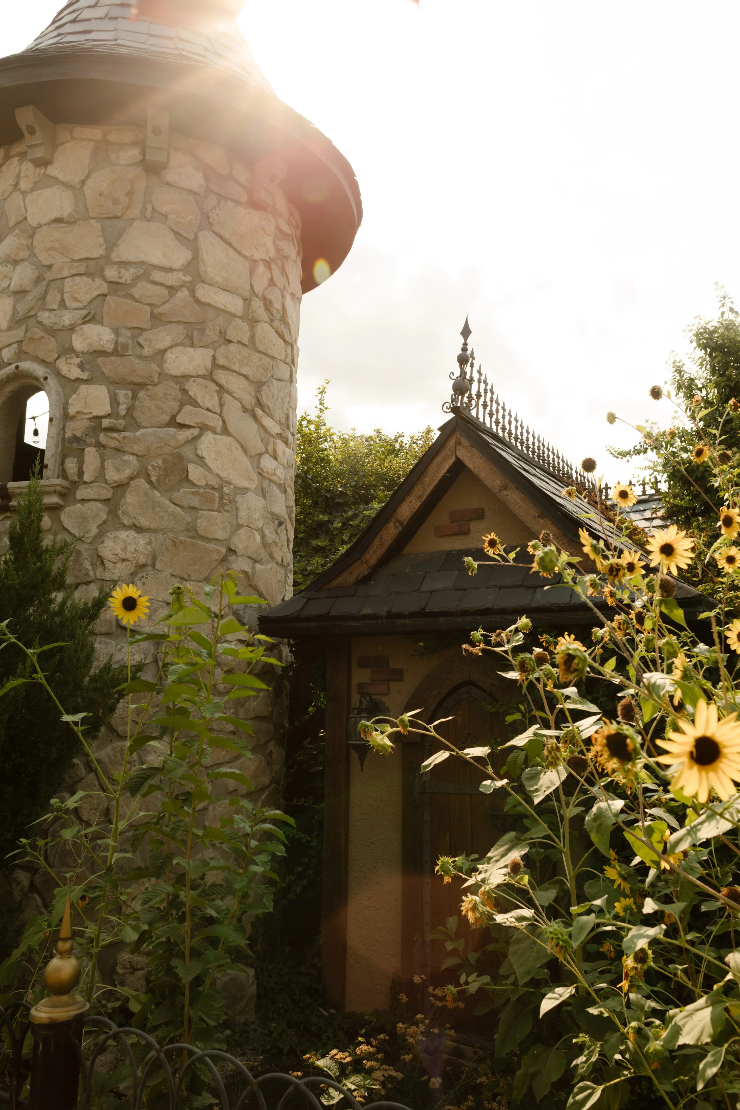 Outside of castle-inspired utah wedding venue with stone-covered walls. 