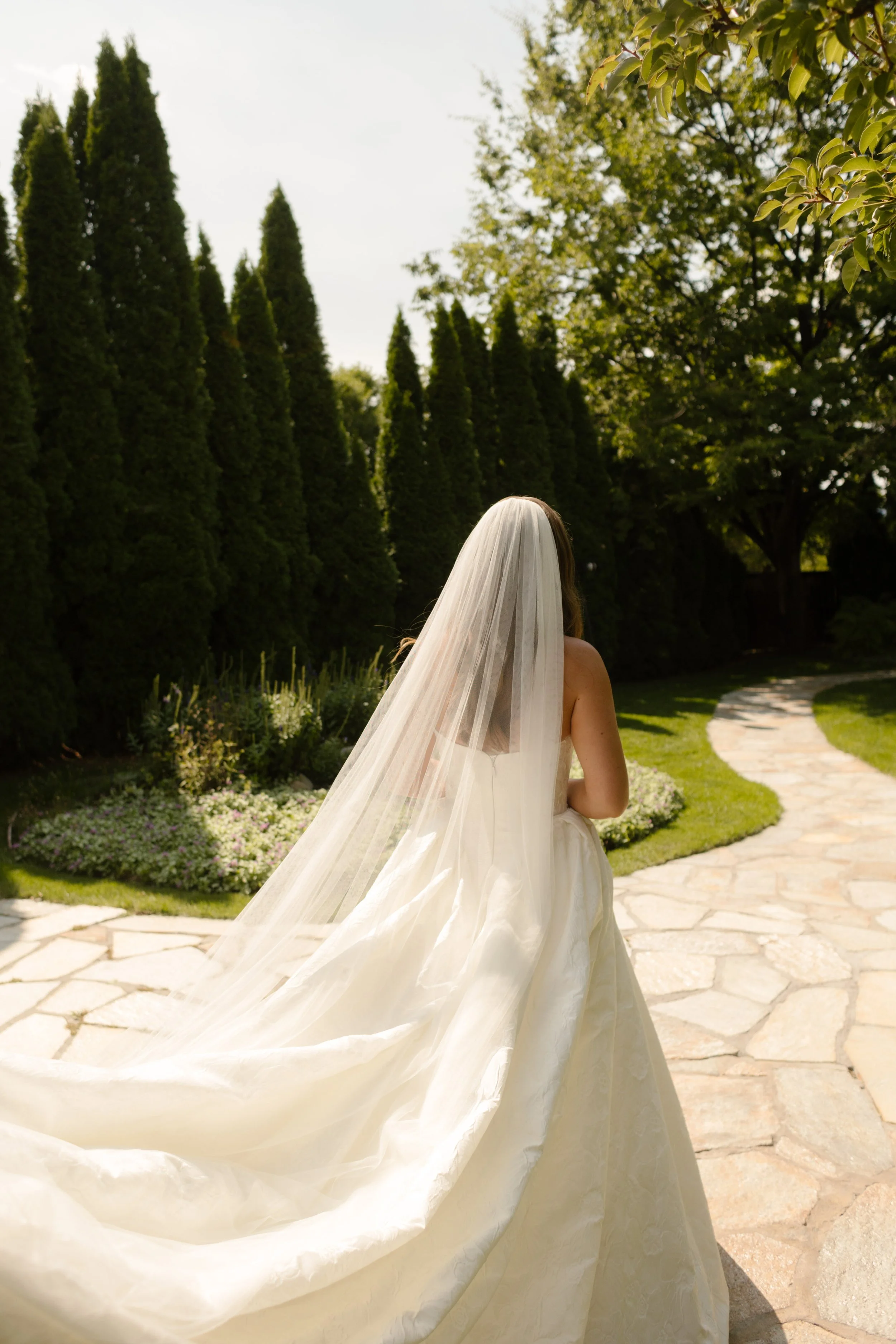 Bride walking out to see her father for the first time in her wedding dress. 