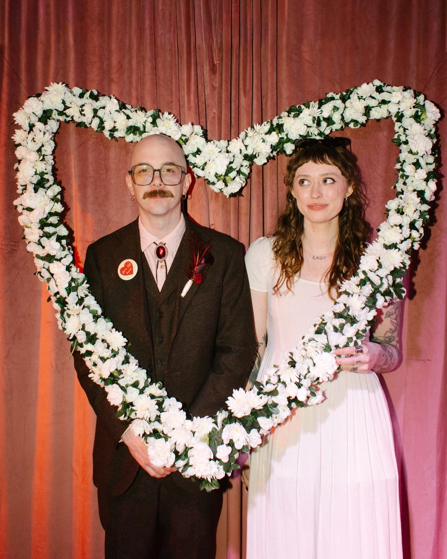 SAV AND ZACH AT THEIR WEDDING ❤️🩷

A playlist carefully curated, paper chains made by hand, cigarettes on the patio and candles on a wedding cake. It was all them and all perfect. At one point I looked around to see everyone sporting their (handmade