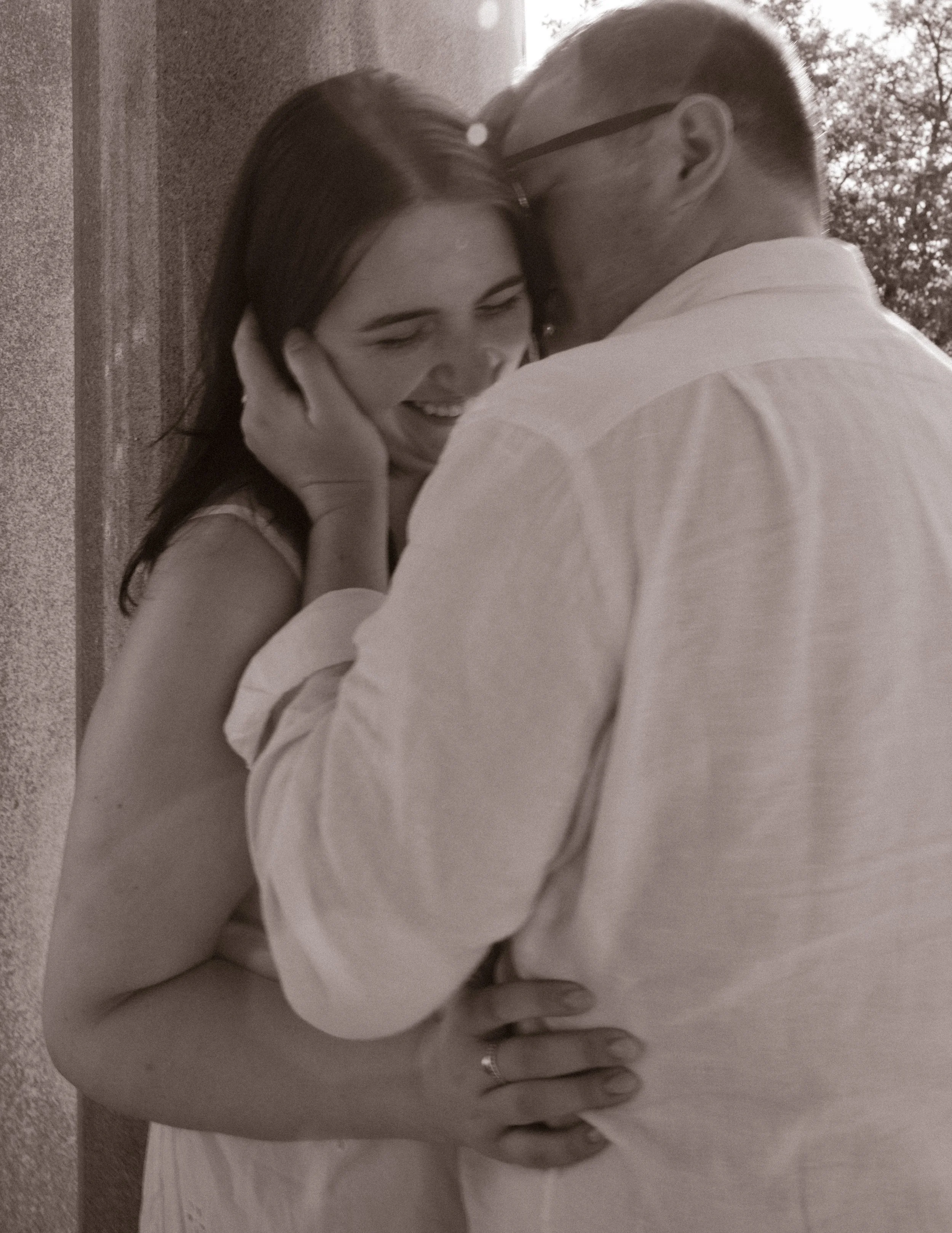 Romantic close embrace between couple during Newport Rhode Island engagement photos