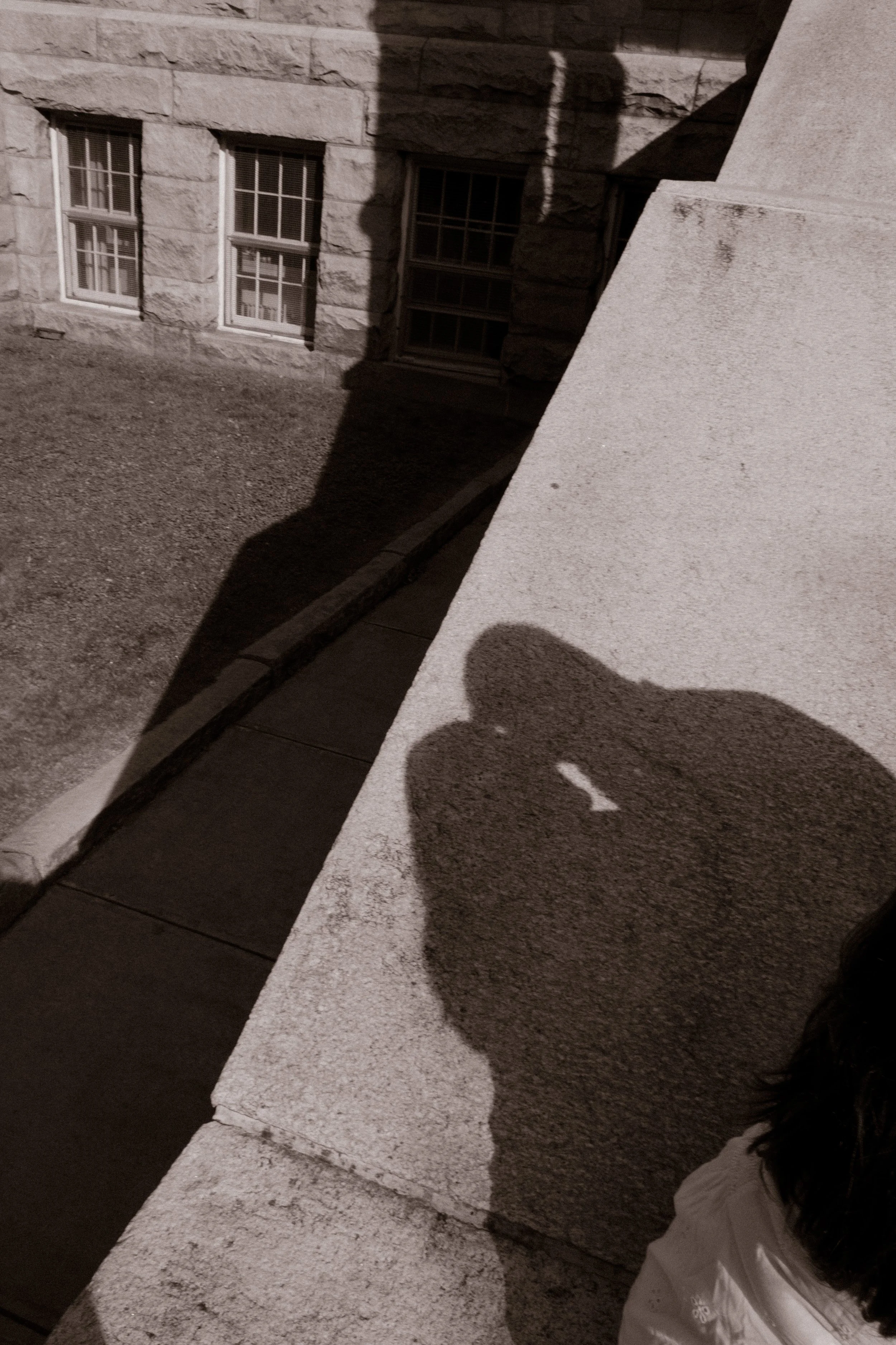 Shadow silhouette of couple kissing on historic Newport City Hall steps