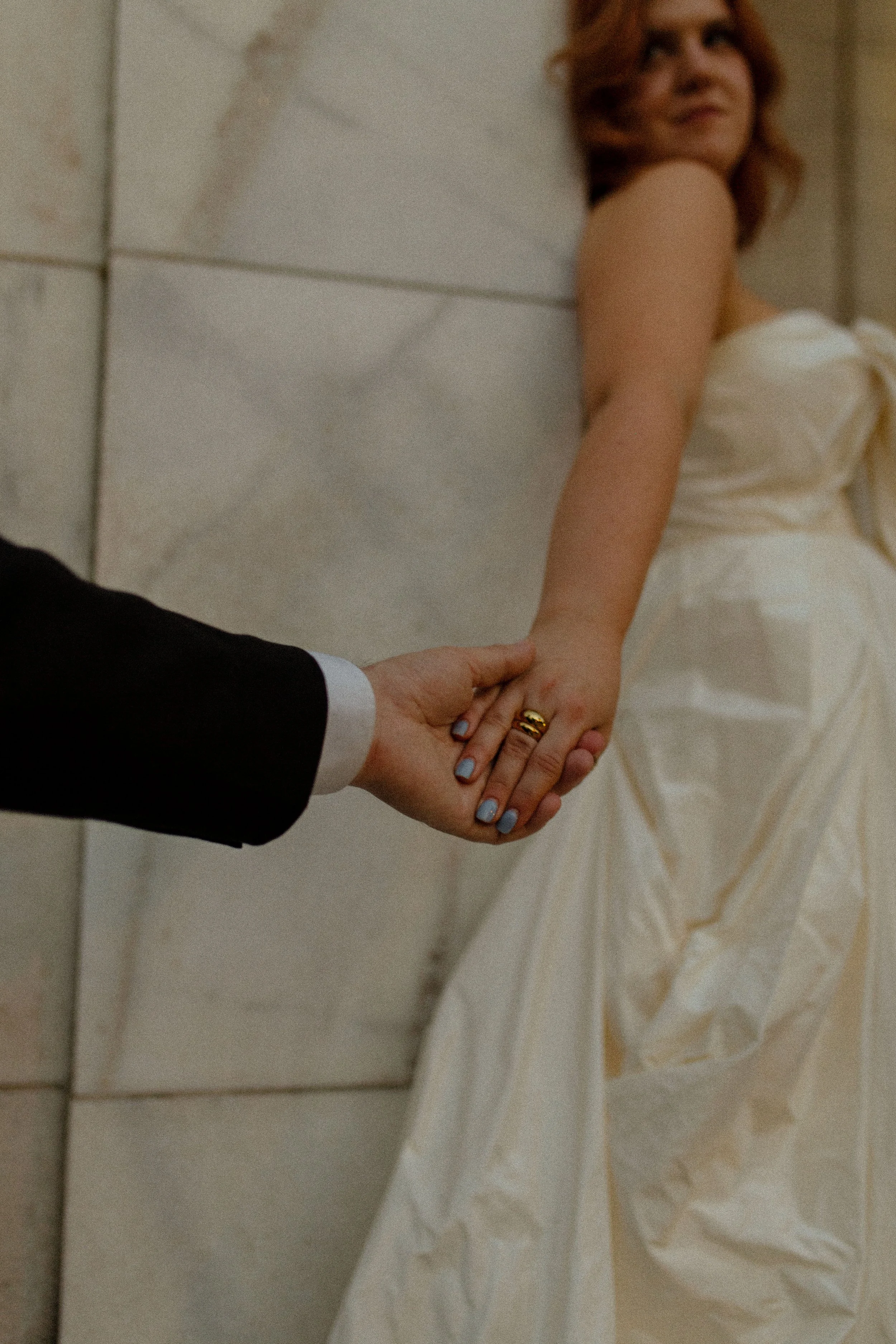 Close-up of intertwined hands, engagement ring visible, capturing a quiet and meaningful pre wedding photos detail.