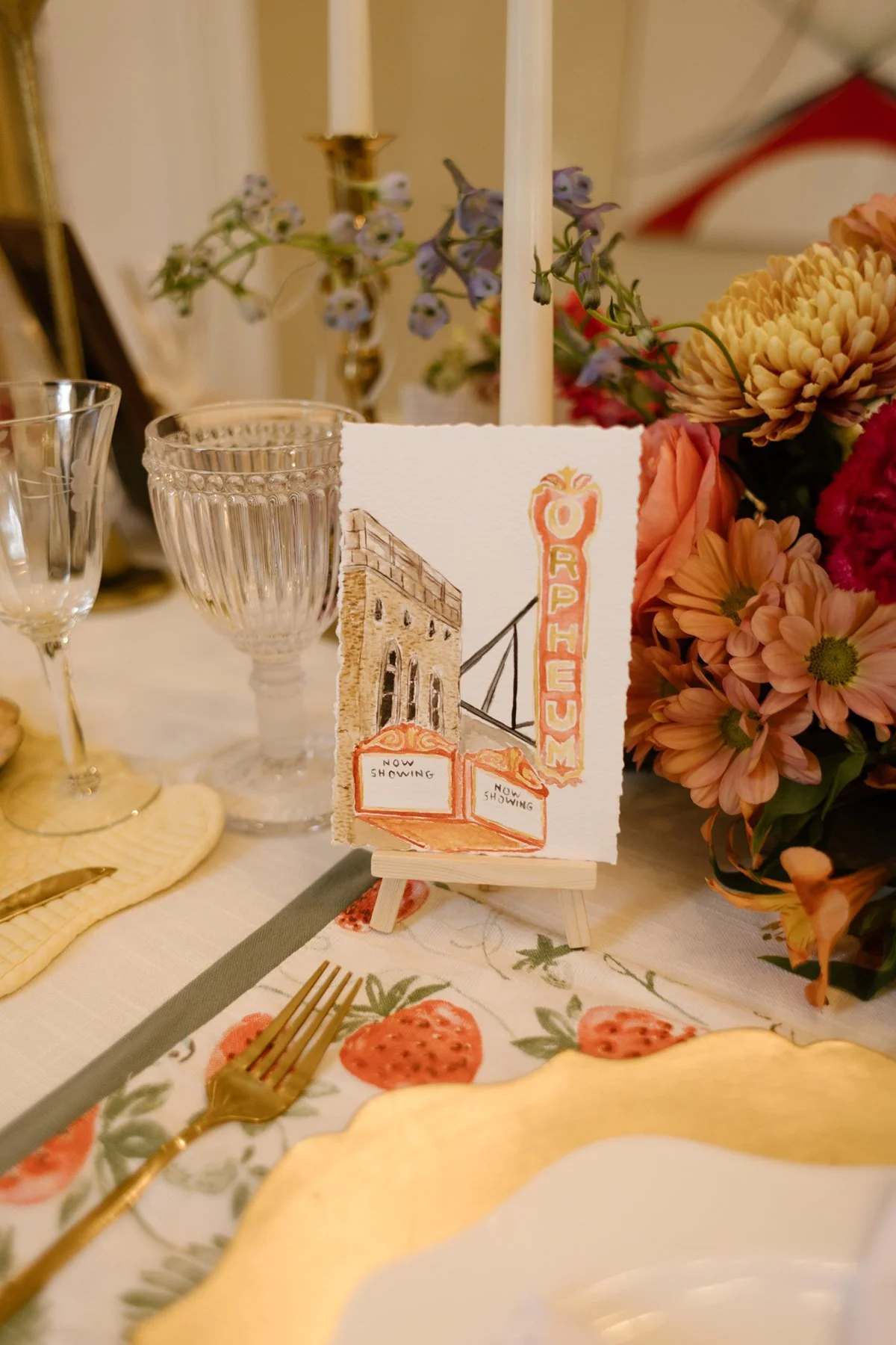 hand-painted table number featuring the orpheum theater, personalized wedding detail at a memphis wedding venue reception