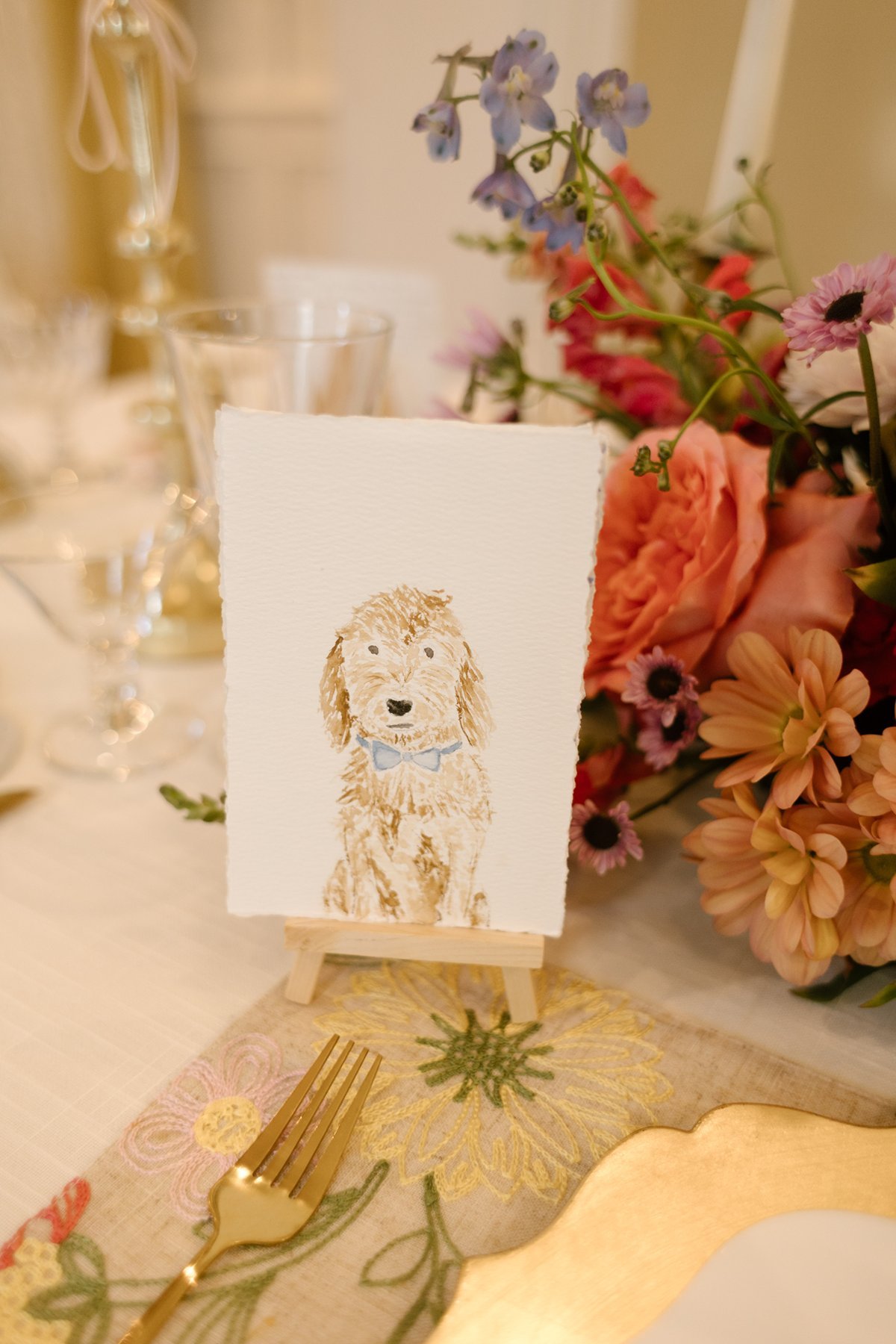 custom dog illustration place card on reception table, playful and personal wedding detail