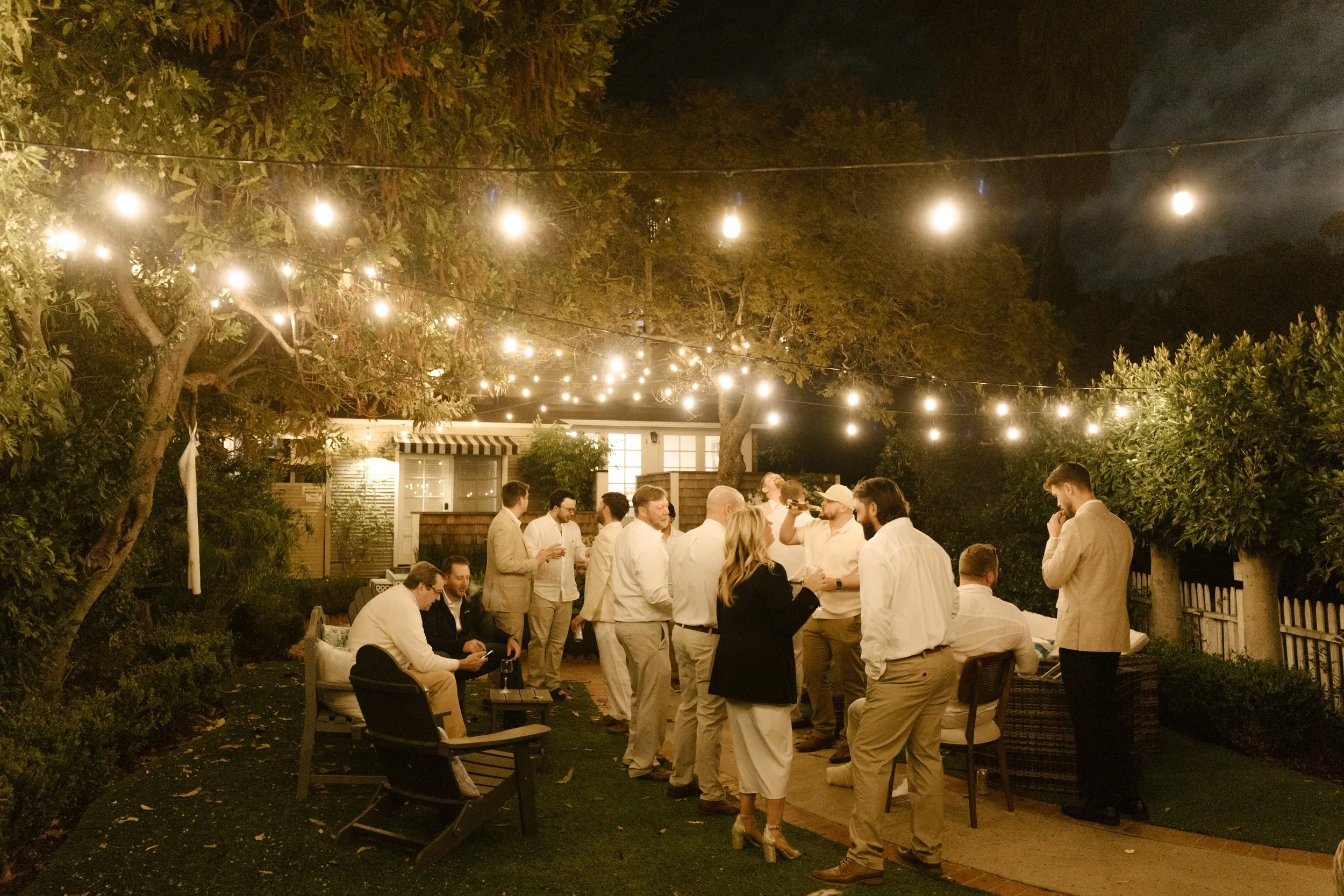 Couple and photographer taking a mirror selfie during a fun behind-the-scenes wedding moment