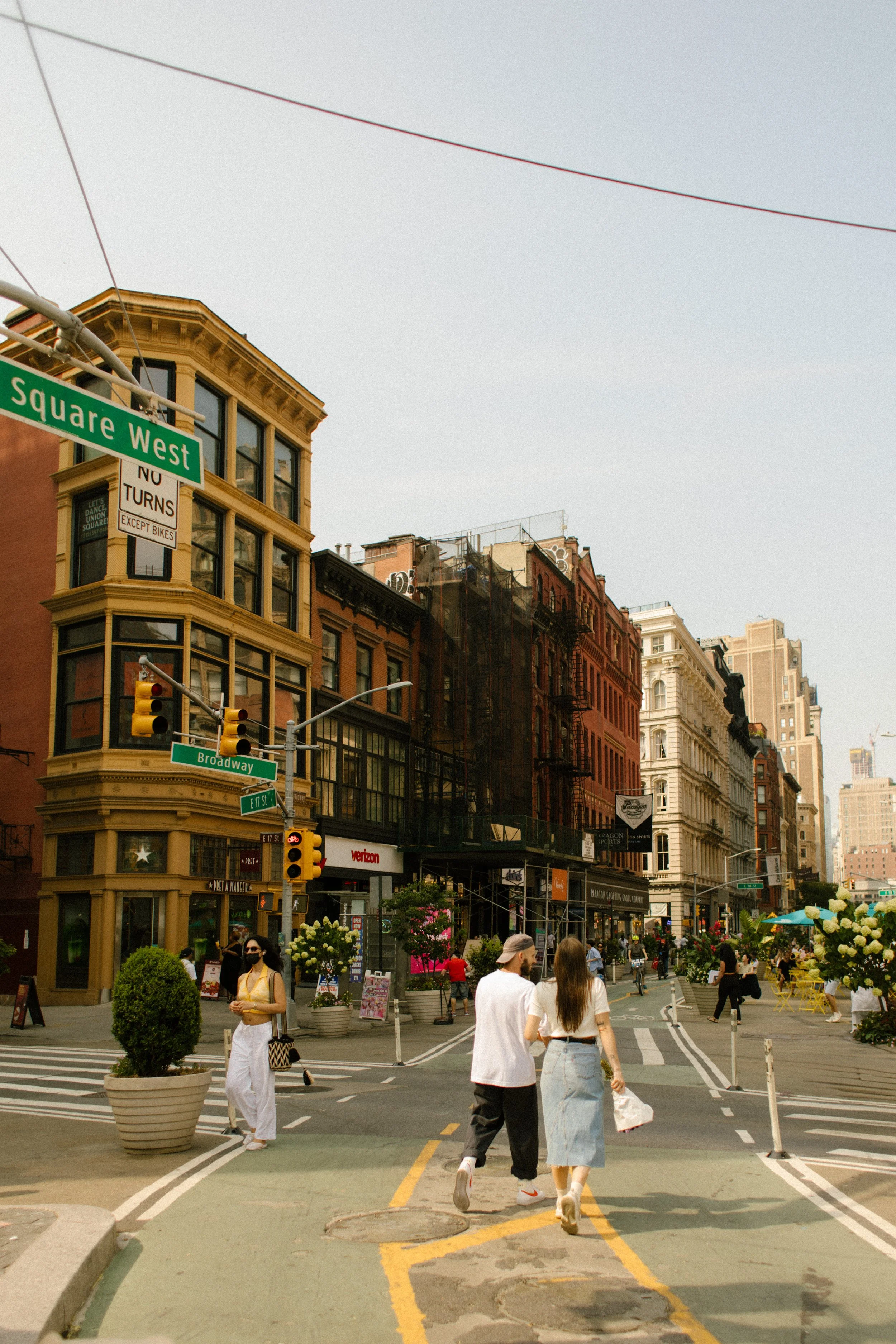 New York engagement photographer photographing a couple walking together through the West Village streets.