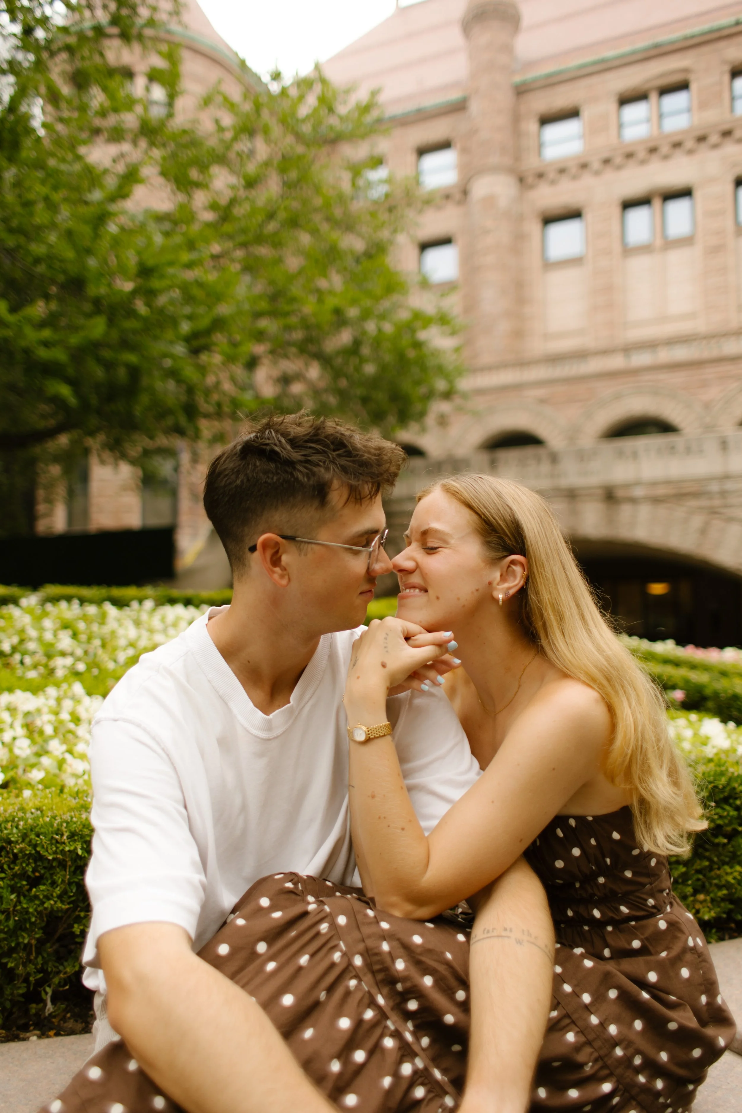 New York engagement photographer capturing editorial-style portraits outside the American Museum of Natural History.