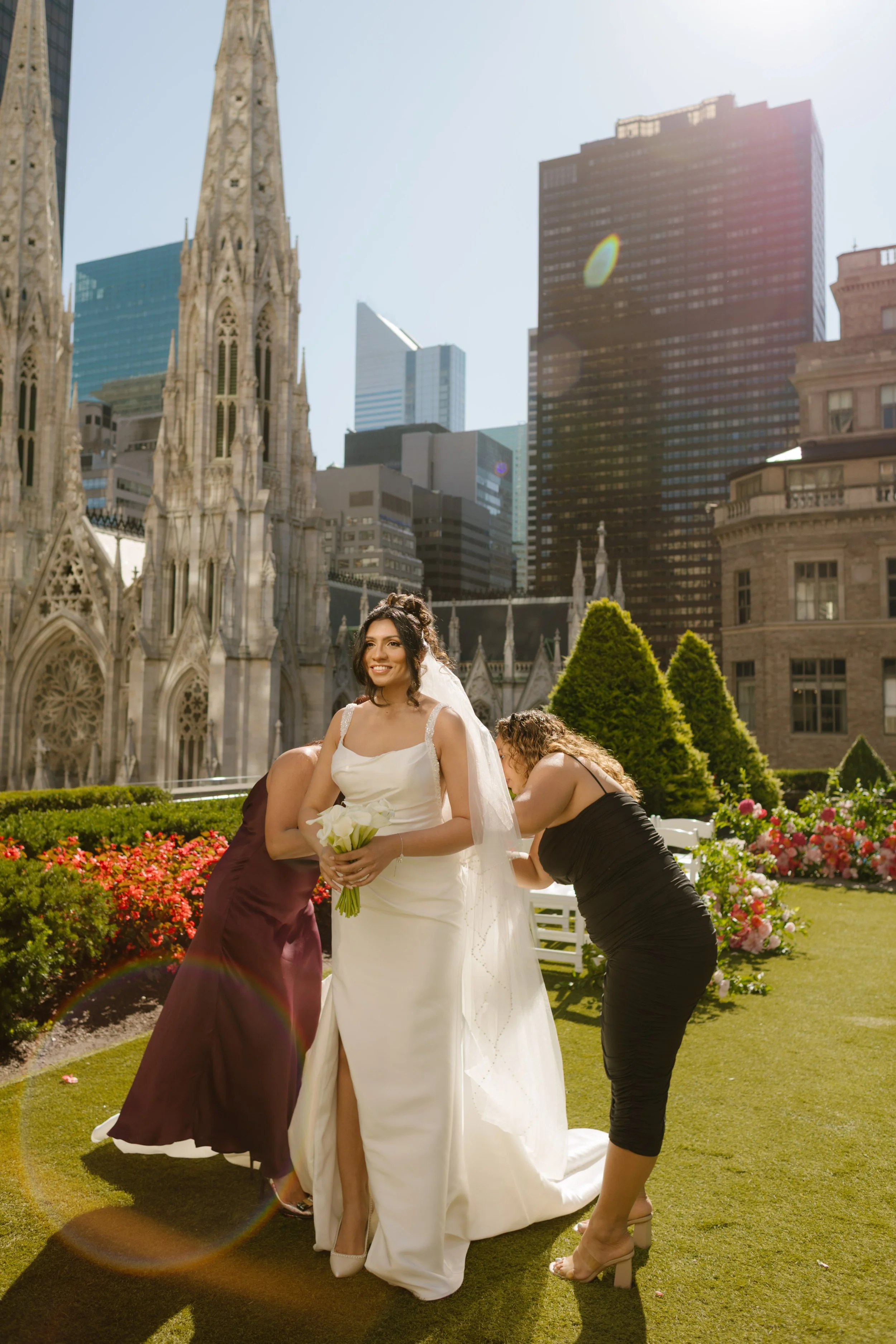 Bride getting ready on rooftop terrace overlooking St. Patrick’s Cathedral before ceremony