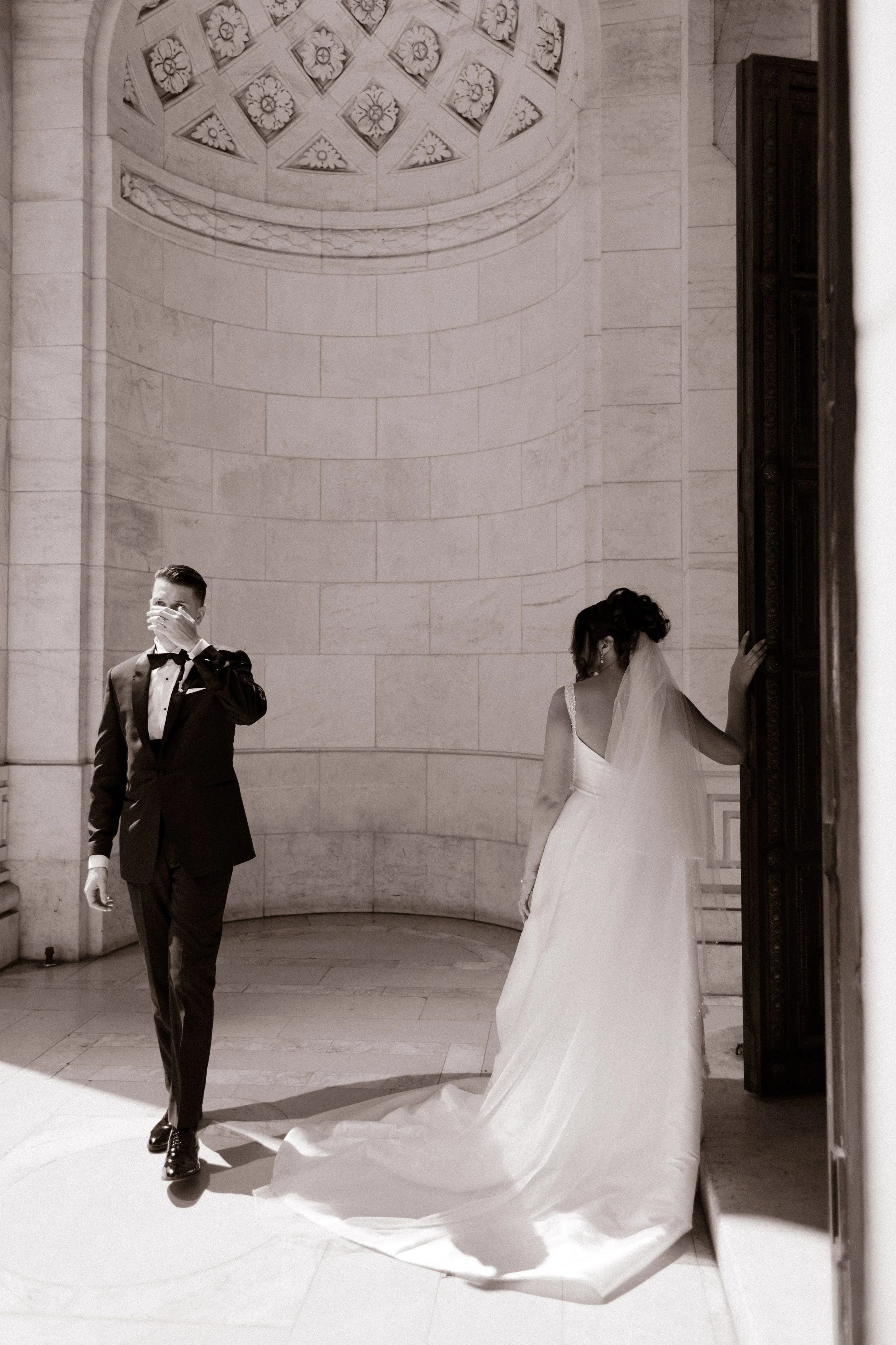 Elegant black-and-white portrait of bride and groom inside marble Manhattan venue