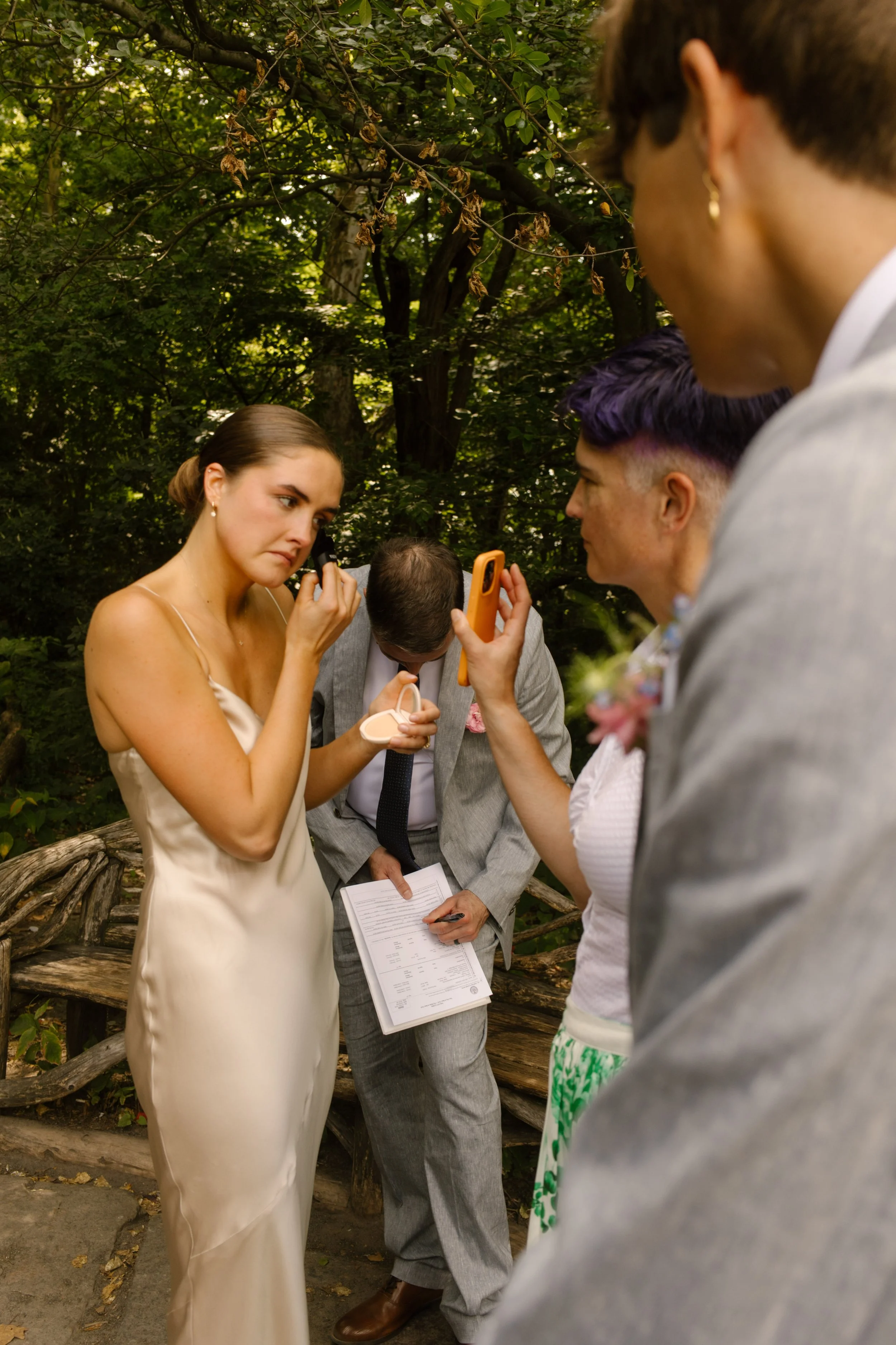 Couple and guests getting ready together in Central Park before intimate wedding ceremony