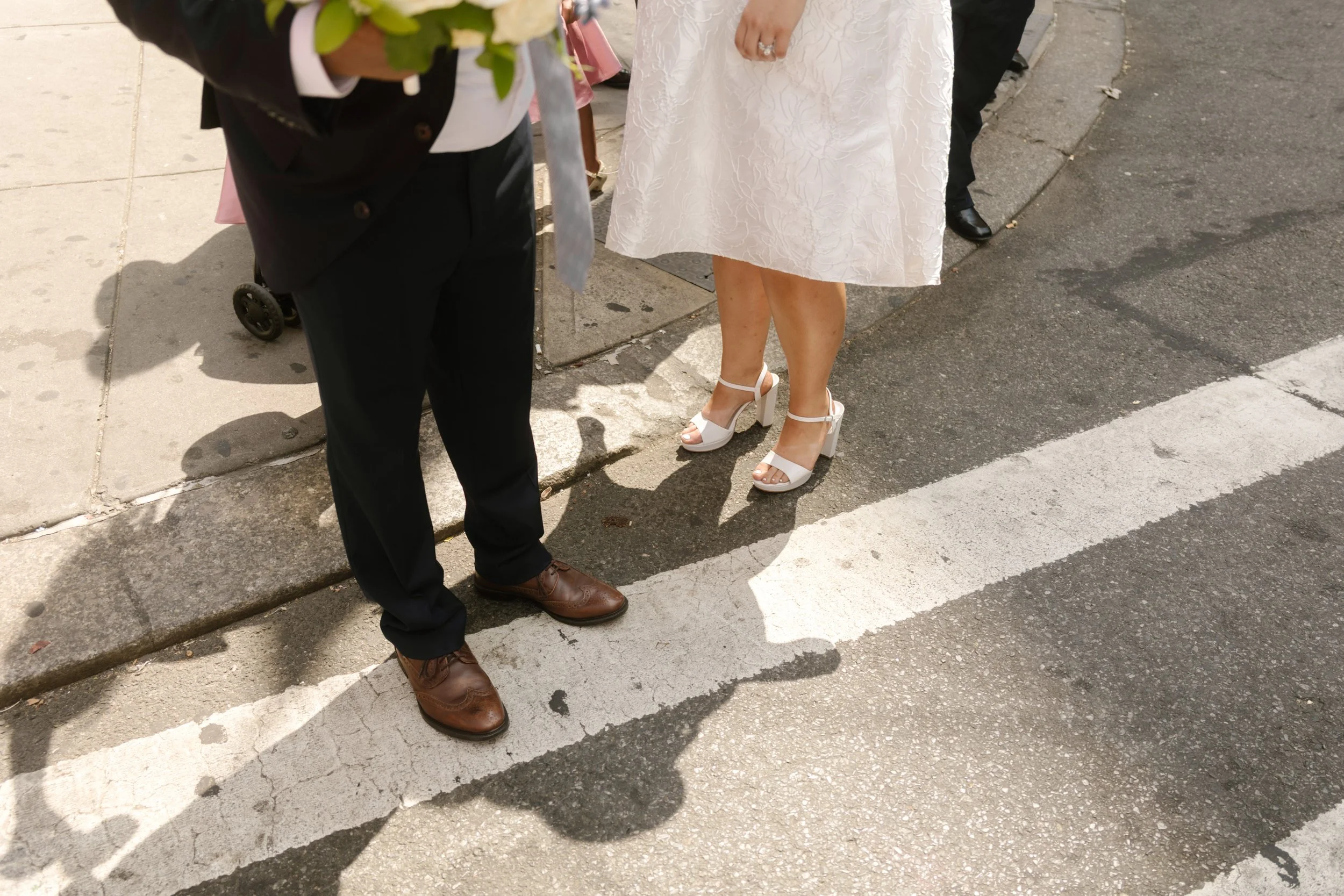 Newlyweds crossing Manhattan street after intimate New York Wedding ceremony