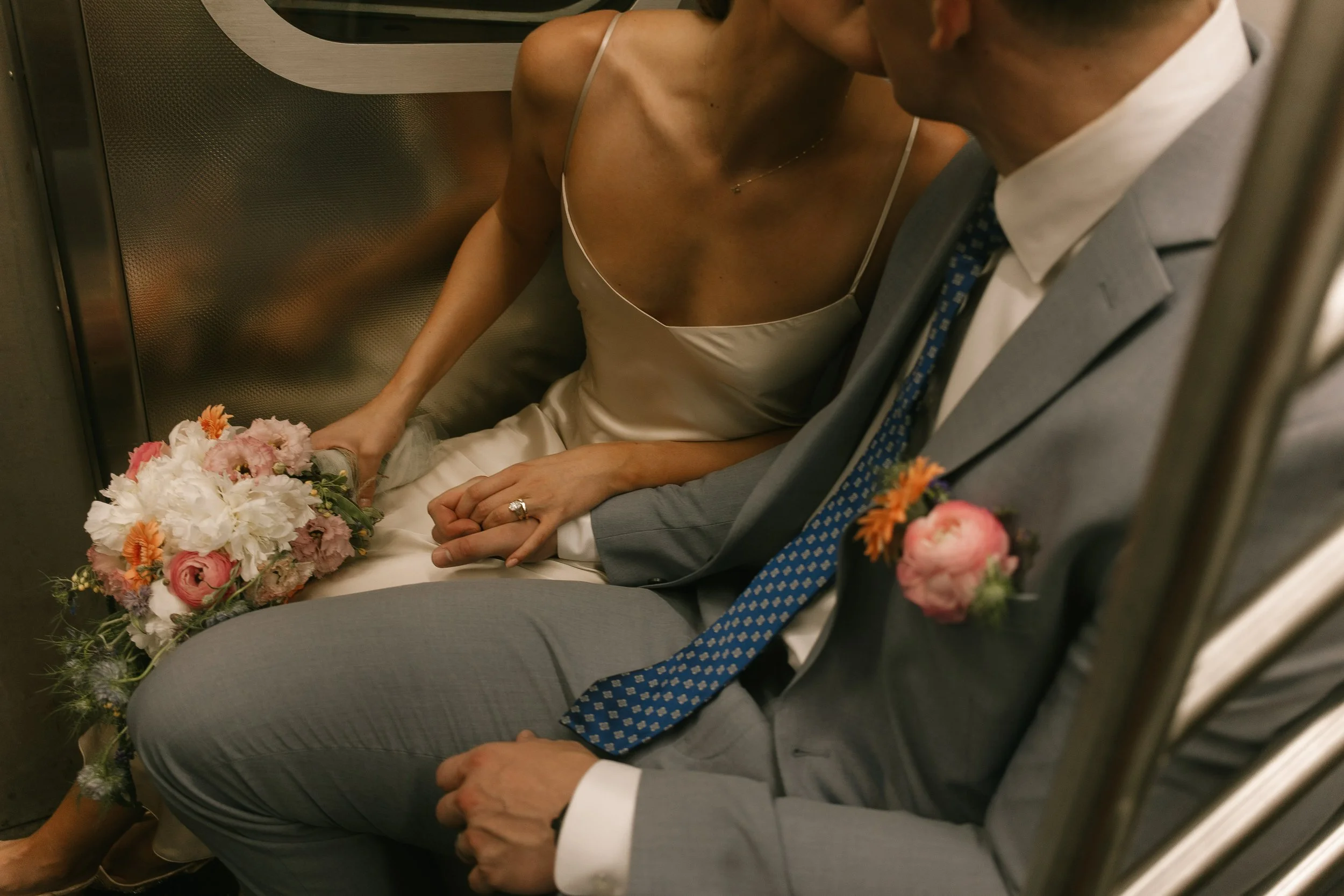 Intimate moment between bride and groom inside vintage New York City taxi cab