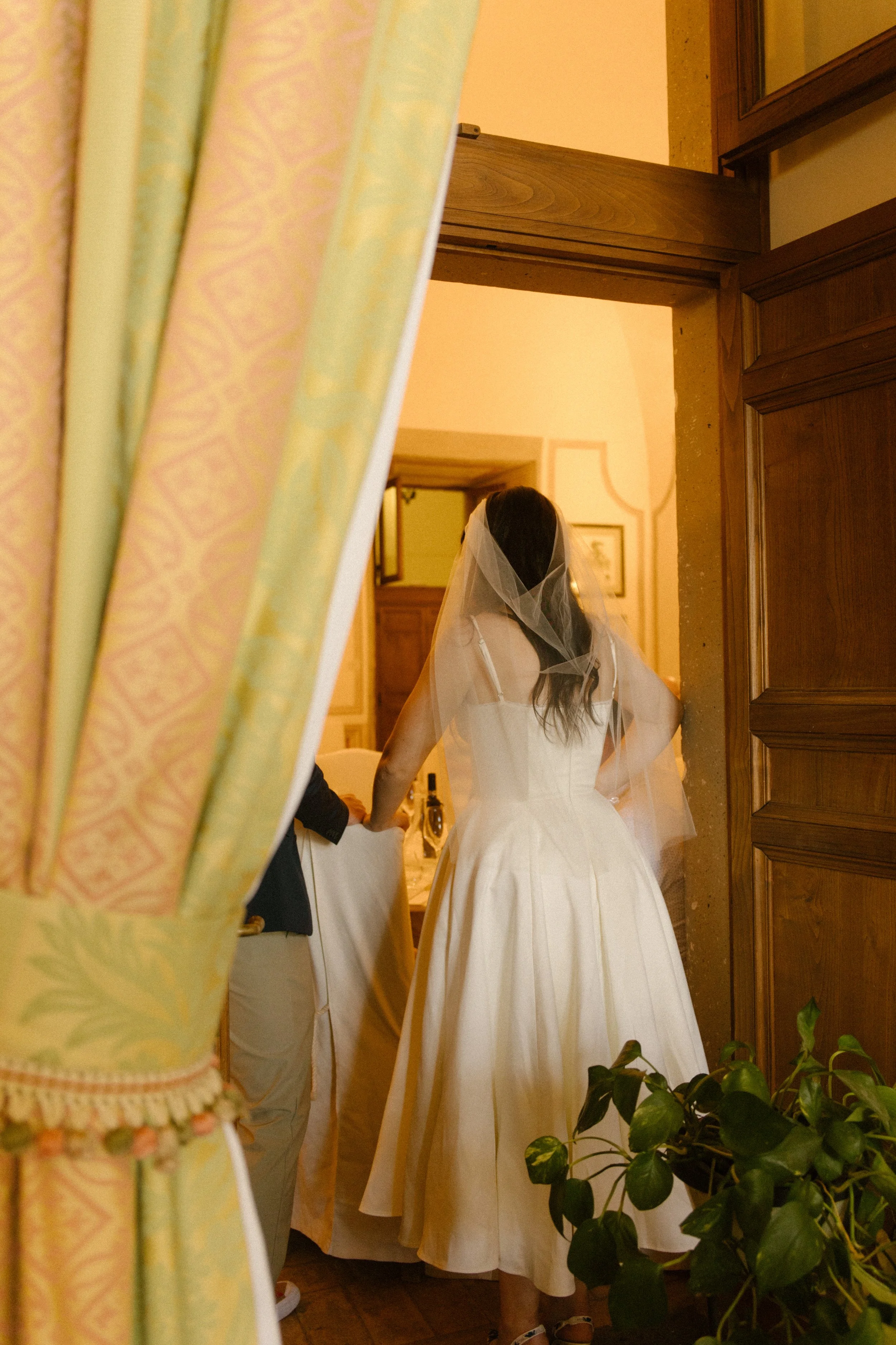 Bride walking into a villa reception space during a destination wedding in Italy brunch