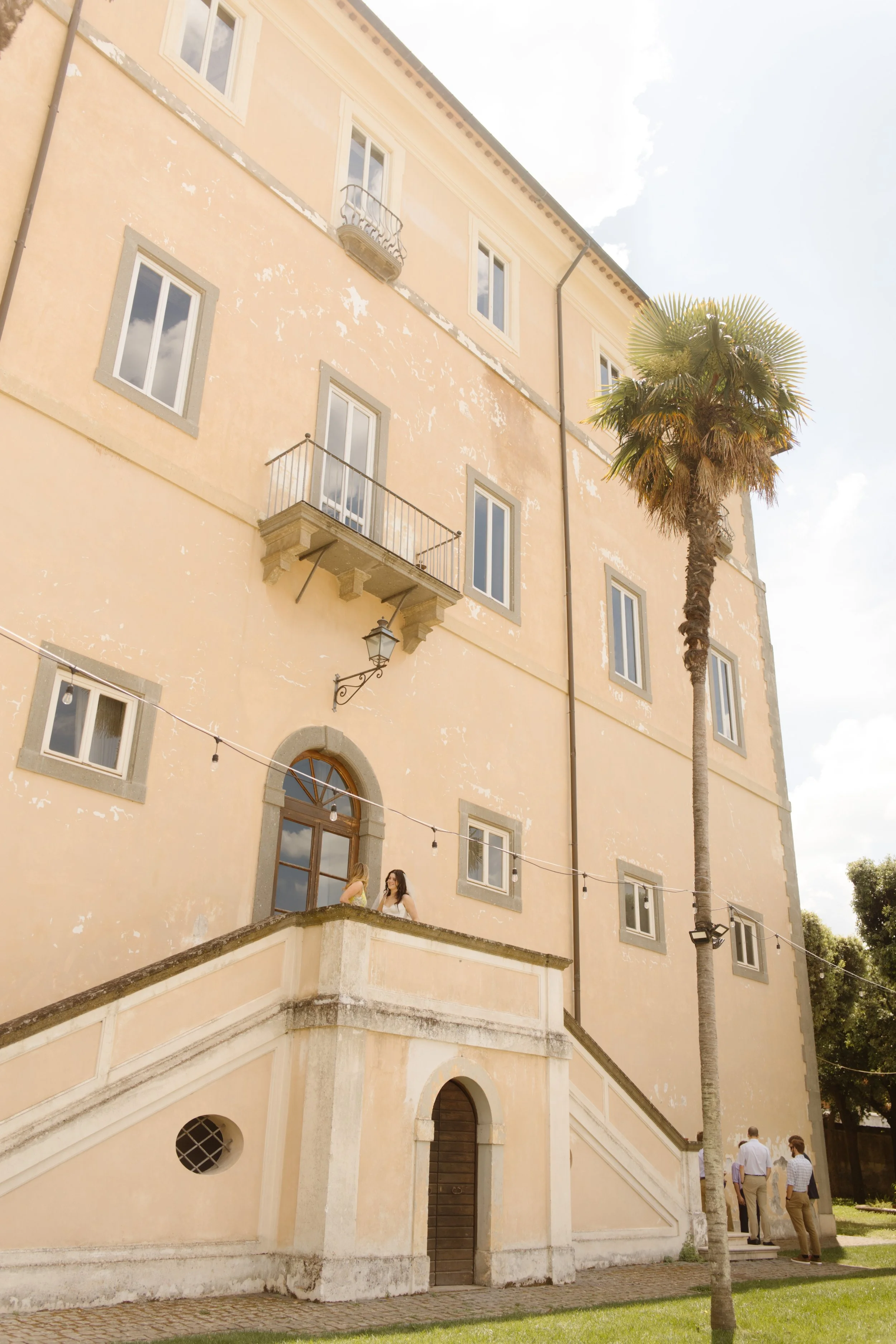 Wide view of a historic Italian villa during a destination wedding in Italy celebration.